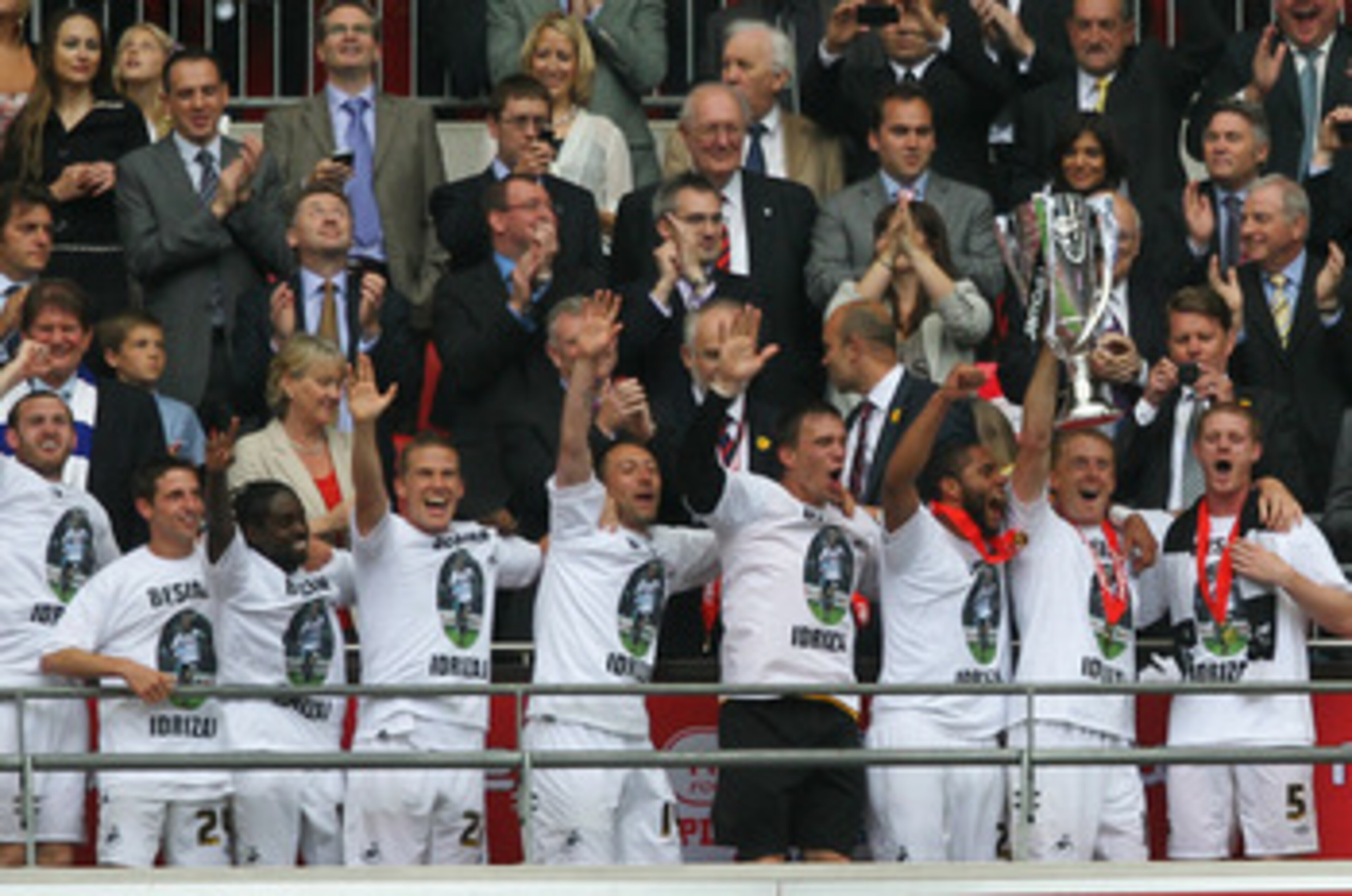 LONDON, ENGLAND - MAY 30:  Garry Monk, Captain of Swansea leads celebrations with the trophy after winning the npower Championship Playoff Final between Reading and Swansea City at Wembley Stadium on May 30, 2011 in London, England.  (Photo by Dean Mouhta
