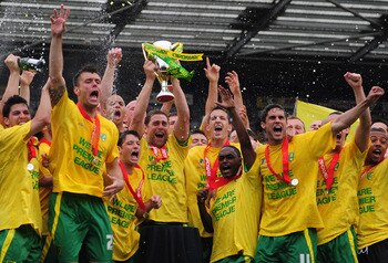 NORWICH, ENGLAND - MAY 07:  Norwich City players celebrate promotion during the npower Championship match between Norwich City and Coventry City at Carrow Road on May 7, 2011 in Norwich, England.  (Photo by Jamie McDonald/Getty Images)