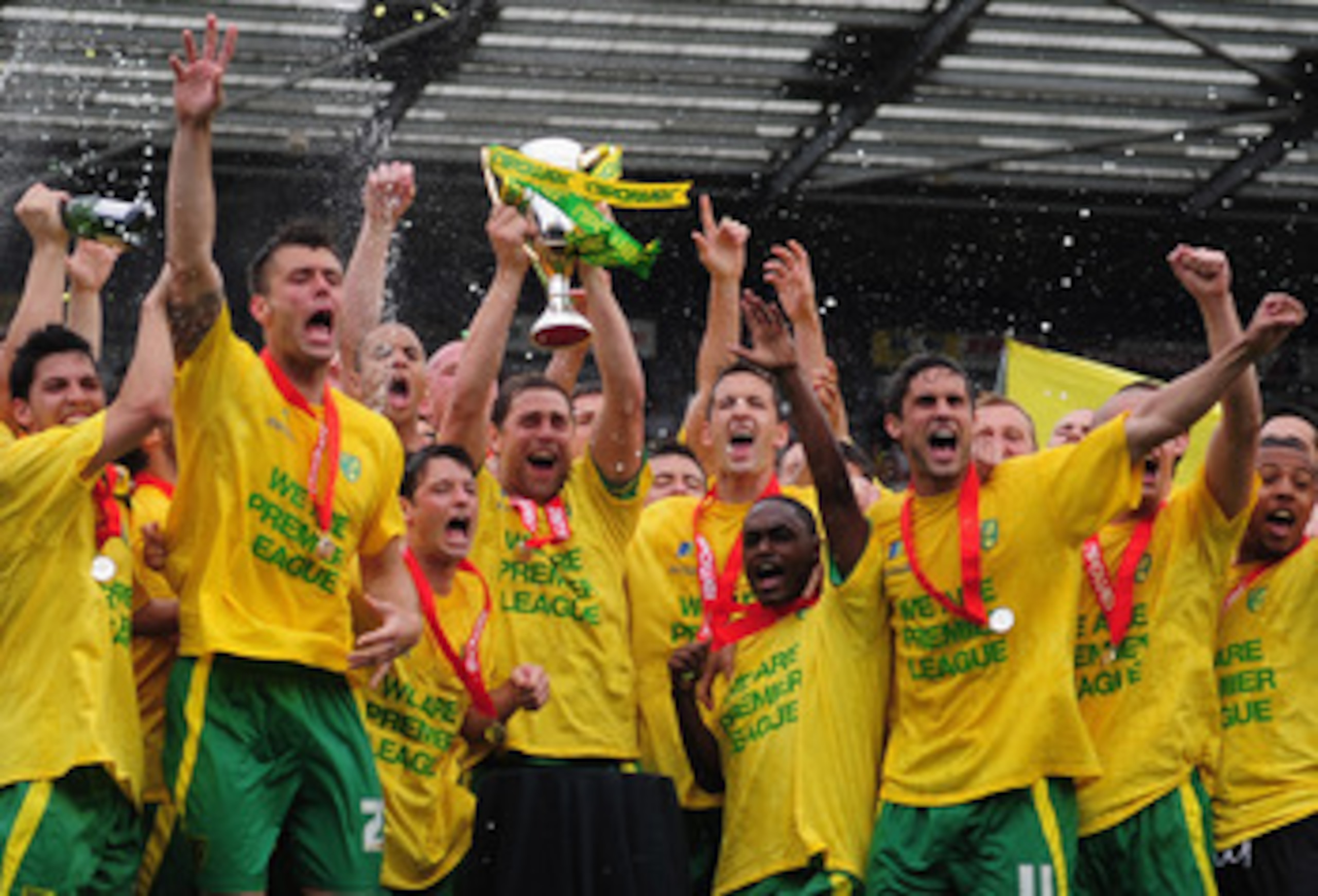 NORWICH, ENGLAND - MAY 07:  Norwich City players celebrate promotion during the npower Championship match between Norwich City and Coventry City at Carrow Road on May 7, 2011 in Norwich, England.  (Photo by Jamie McDonald/Getty Images)