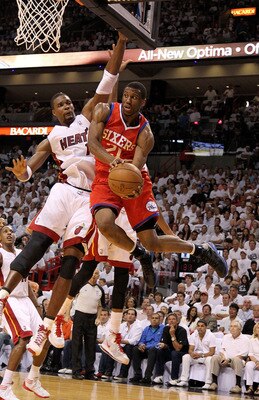 MIAMI, FL - APRIL 27:  Thaddeus Young #21 of the Philadelphia 76ers drives past Chris Bosh #1 of the Miami Heat during game five of the Eastern Conference Quarterfinals in the 2011 NBA Playoffs at American Airlines Arena on April 27, 2011 in Miami, Florid