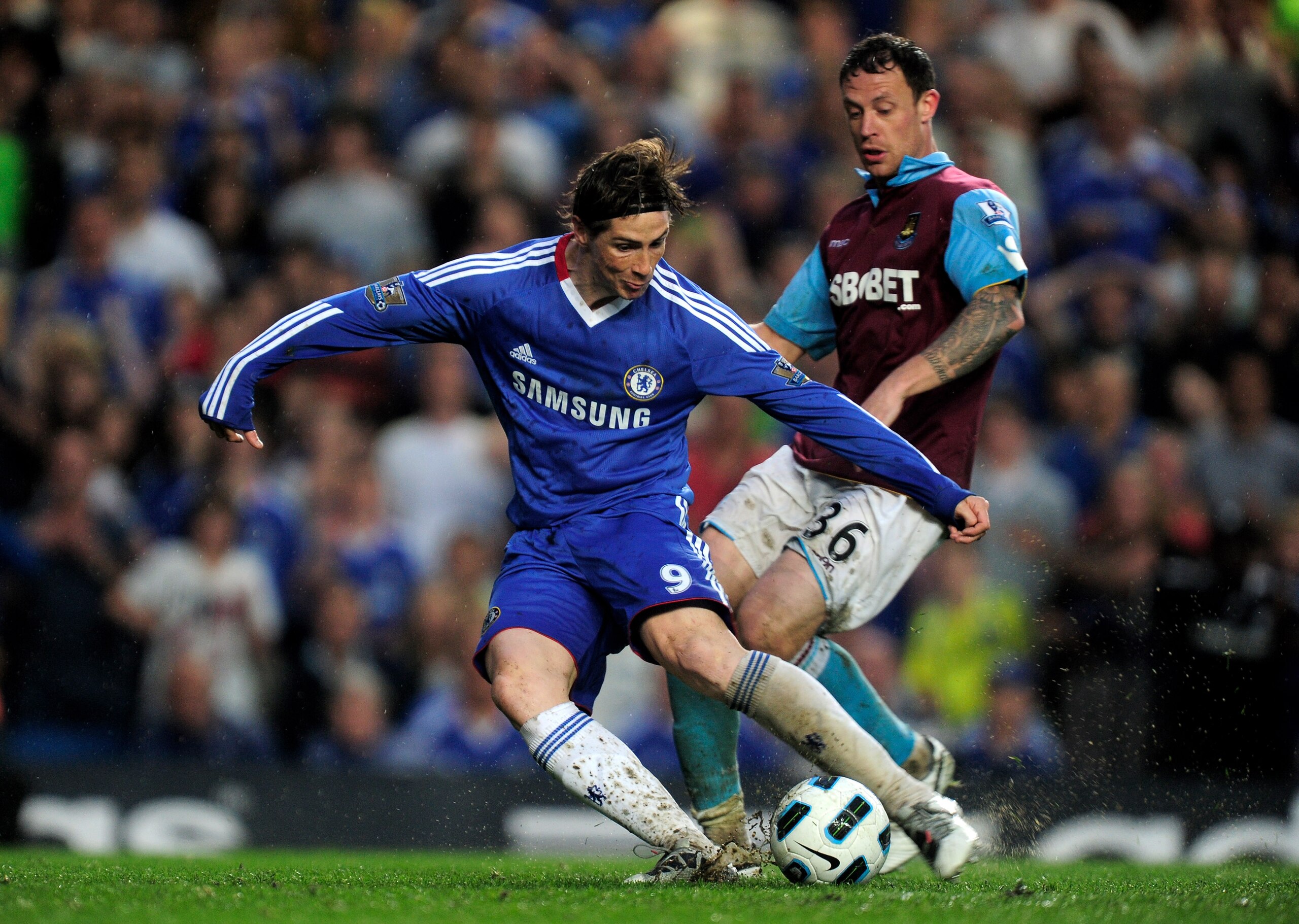 LONDON, ENGLAND - APRIL 23: Fernando Torres of Chelsea scores his team's second goal and the first of his Chelsea career during the Barclays Premier League match between Chelsea and West Ham United at Stamford Bridge on April 23, 2011 in London, England. LONDON, ENGLAND - APRIL 23: Fernando Torres of Chelsea scores his team's second goal and the first of his Chelsea career during the Barclays Premier League match between Chelsea and West Ham United at Stamford Bridge on April 23, 2011 in London, England.