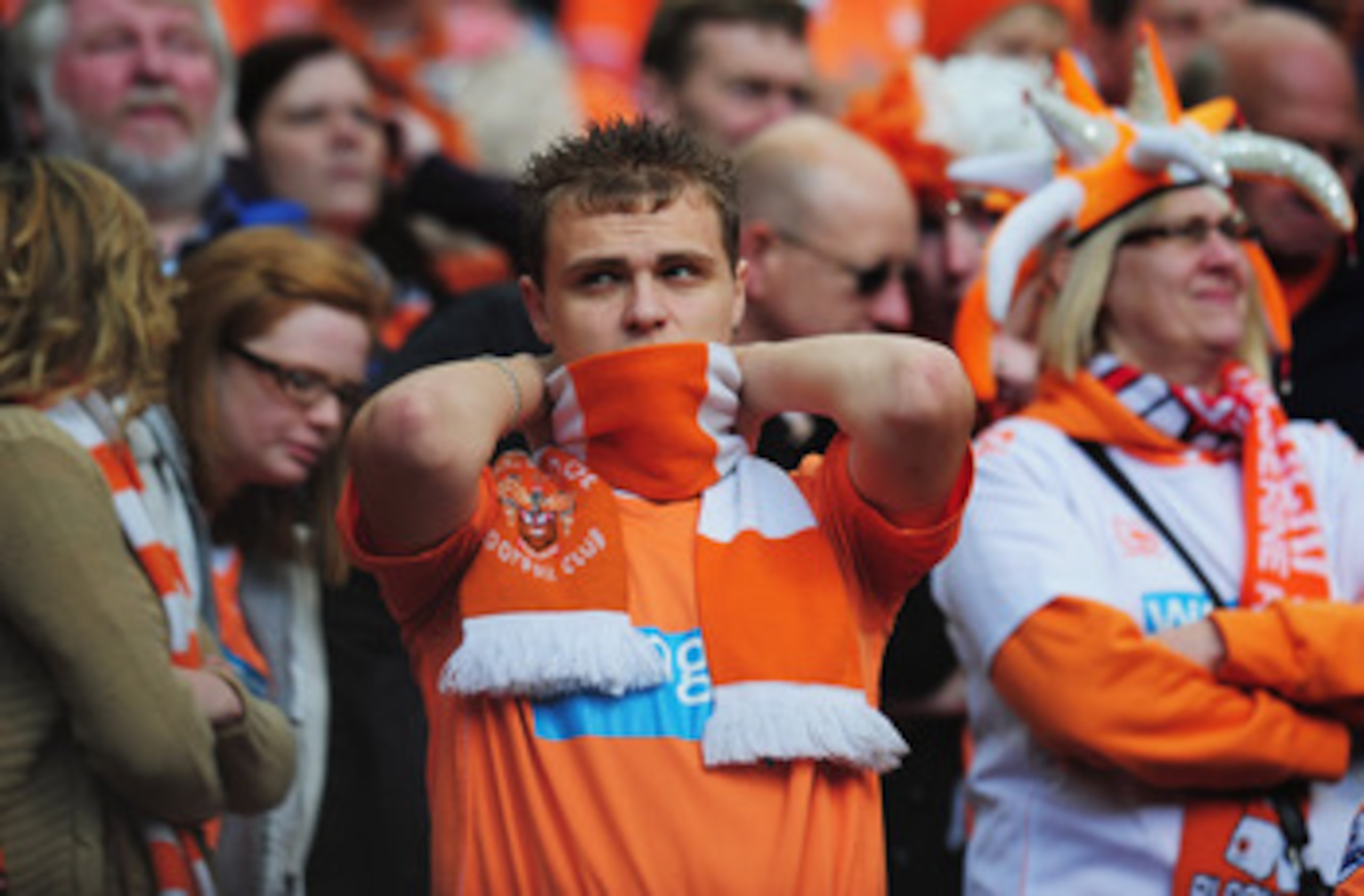 MANCHESTER, ENGLAND - MAY 22:  A Blackpool fan looks dejected as they are relegated during the Barclays Premier League match between Manchester United and Blackpool at Old Trafford on May 22, 2011 in Manchester, England.  (Photo by Shaun Botterill/Getty I