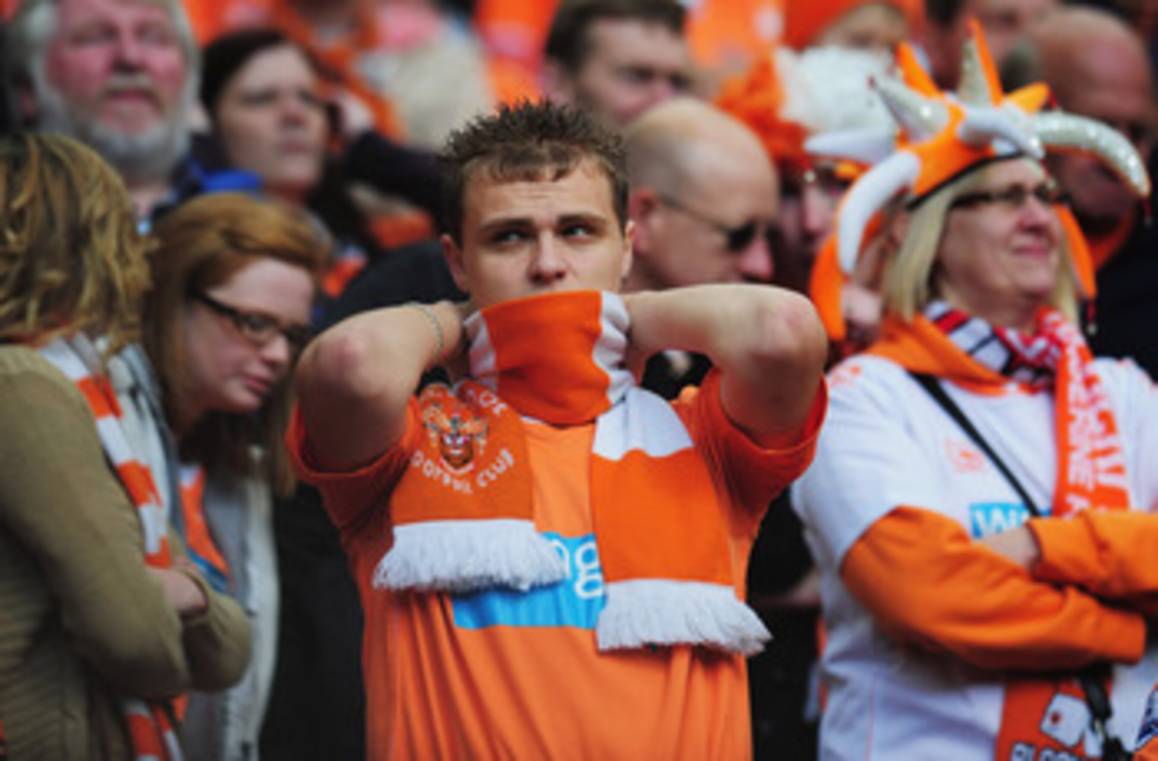 MANCHESTER, ENGLAND - MAY 22:  A Blackpool fan looks dejected as they are relegated during the Barclays Premier League match between Manchester United and Blackpool at Old Trafford on May 22, 2011 in Manchester, England.  (Photo by Shaun Botterill/Getty I