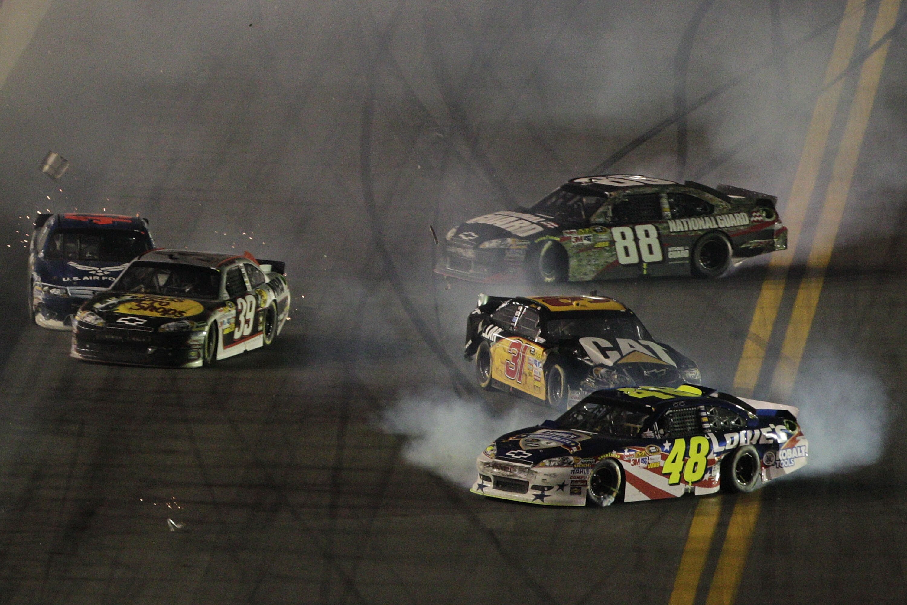 DAYTONA BEACH, FL - JULY 02:  Jimmie Johnson, driver of the #48 Lowe's Summer Salute Chevrolet, Jeff Burton, driver of the #31 Caterpillar Chevrolet, Dale Earnhardt Jr., driver of the #88 National Guard Heritage/Amp Energy Chevrolet, and others wreck on t