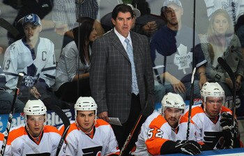 LONDON,ON - SEPTEMBER 23: Head Coach Peter Laviolette of the Philadelphia Flyers watches the play in a pre-season game against the Toronto Maple Leafs on September 23,2010 at the John Labatt Centre in London, Ontario. The Leafs defeated the Flyers 3-2 in LONDON,ON - SEPTEMBER 23: Head Coach Peter Laviolette of the Philadelphia Flyers watches the play in a pre-season game against the Toronto Maple Leafs on September 23,2010 at the John Labatt Centre in London, Ontario. The Leafs defeated the Flyers 3-2 in