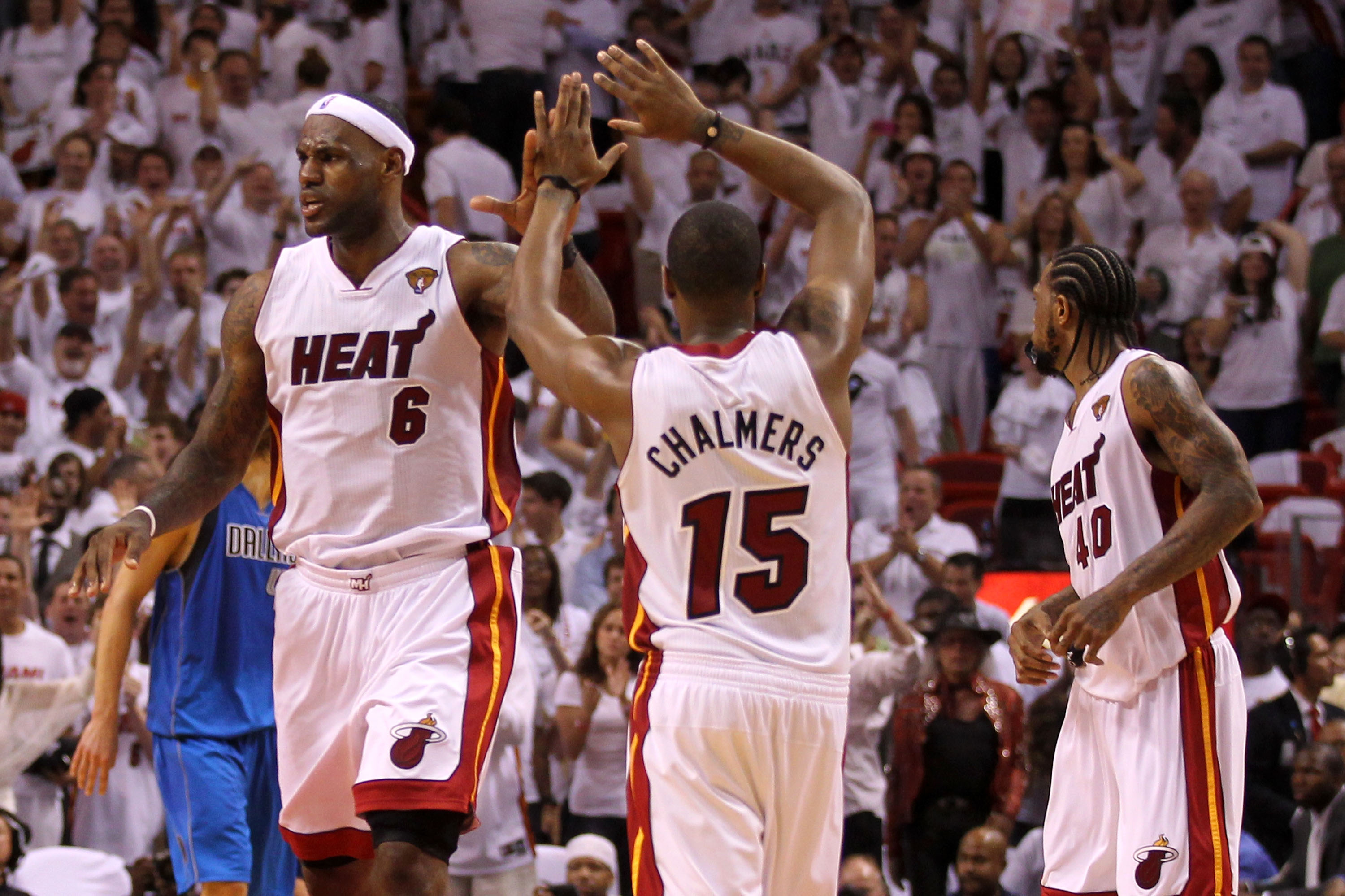 MIAMI, FL - MAY 31:  (L) LeBron James #6 of the Miami Heat reacts with teammate Mario Chalmers #15 in the fourth quarter while taking on the Dallas Mavericks in Game One of the 2011 NBA Finals at American Airlines Arena on May 31, 2011 in Miami, Florida.