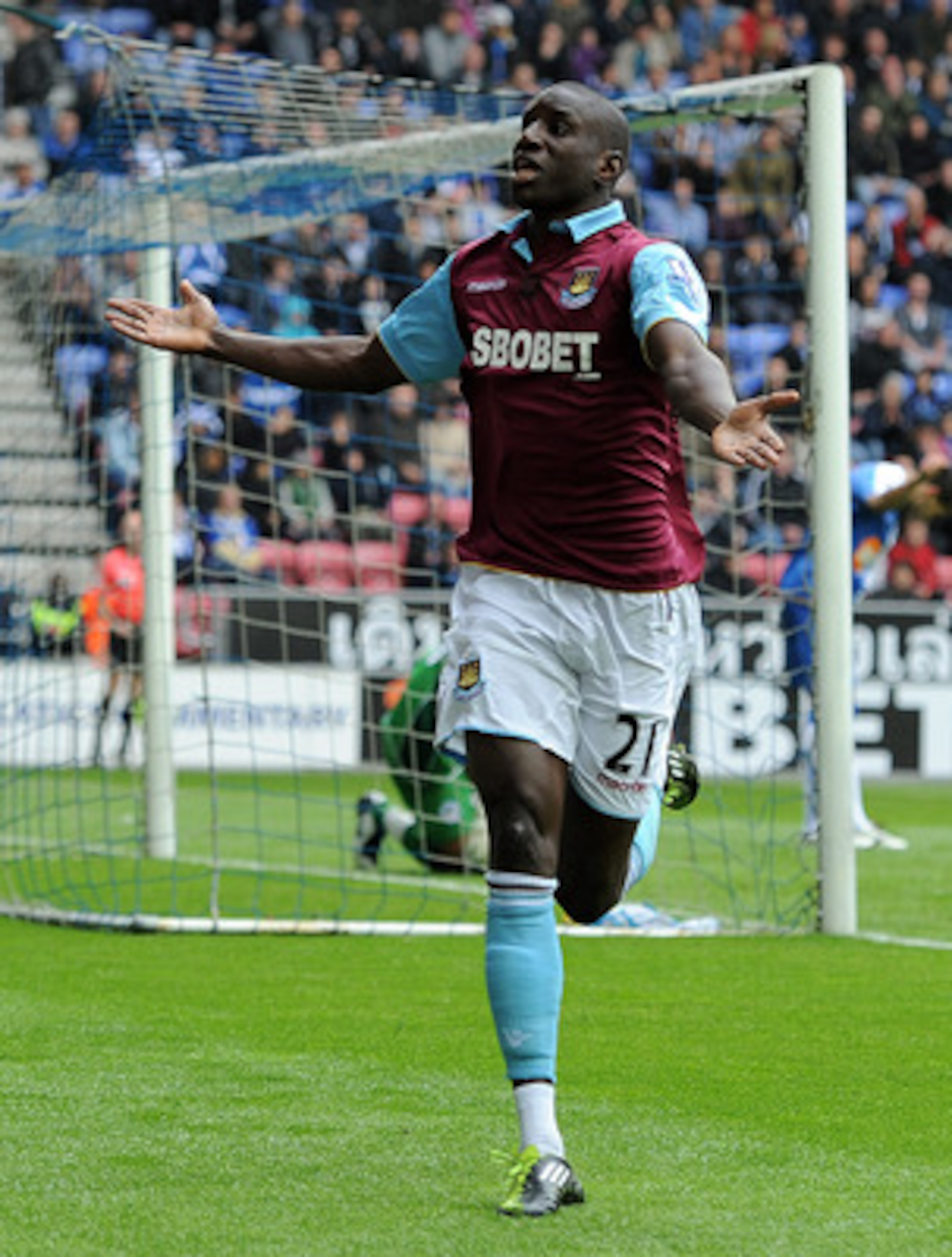 WIGAN, ENGLAND - MAY 15:  Demba Ba of West Ham United celebrates scoring the openng goal during the Barclays Premier League match between Wigan Athletic and West Ham United at the DW Stadium on May 15, 2011 in Wigan, England.  (Photo by Chris Brunskill/Ge