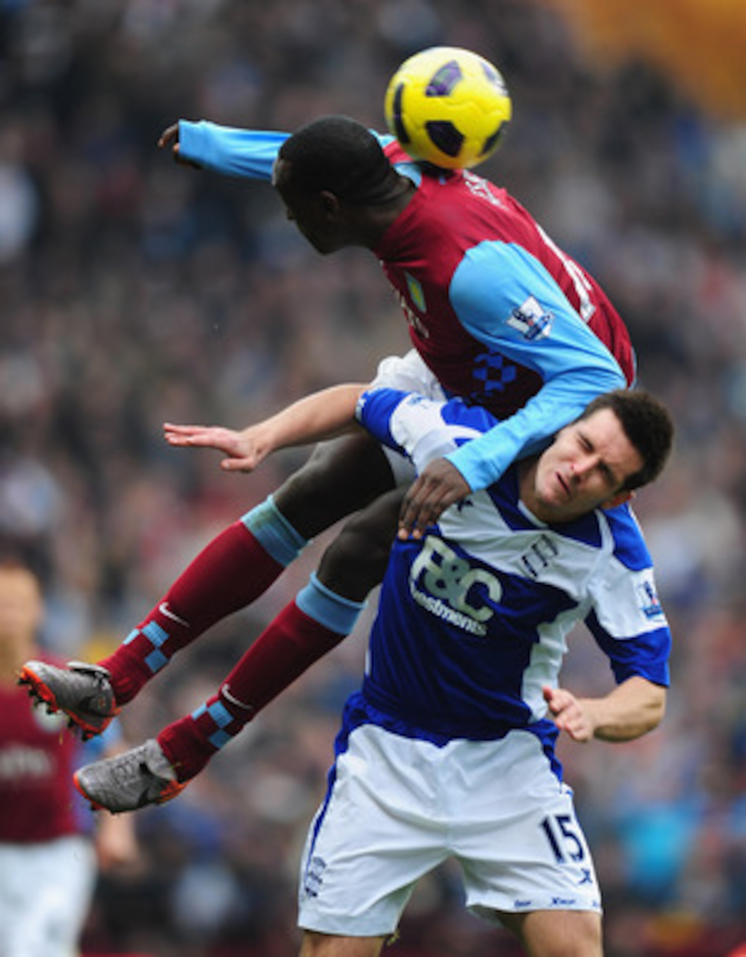 BIRMINGHAM, ENGLAND - OCTOBER 31:  Emile Heskey of Aston Villa climbs all over Scott Dann of Birmingham during the Barclays Premier League match between Aston Villa and Birmingham at Villa Park on October 31, 2010 in London, England.  (Photo by Mike Hewit