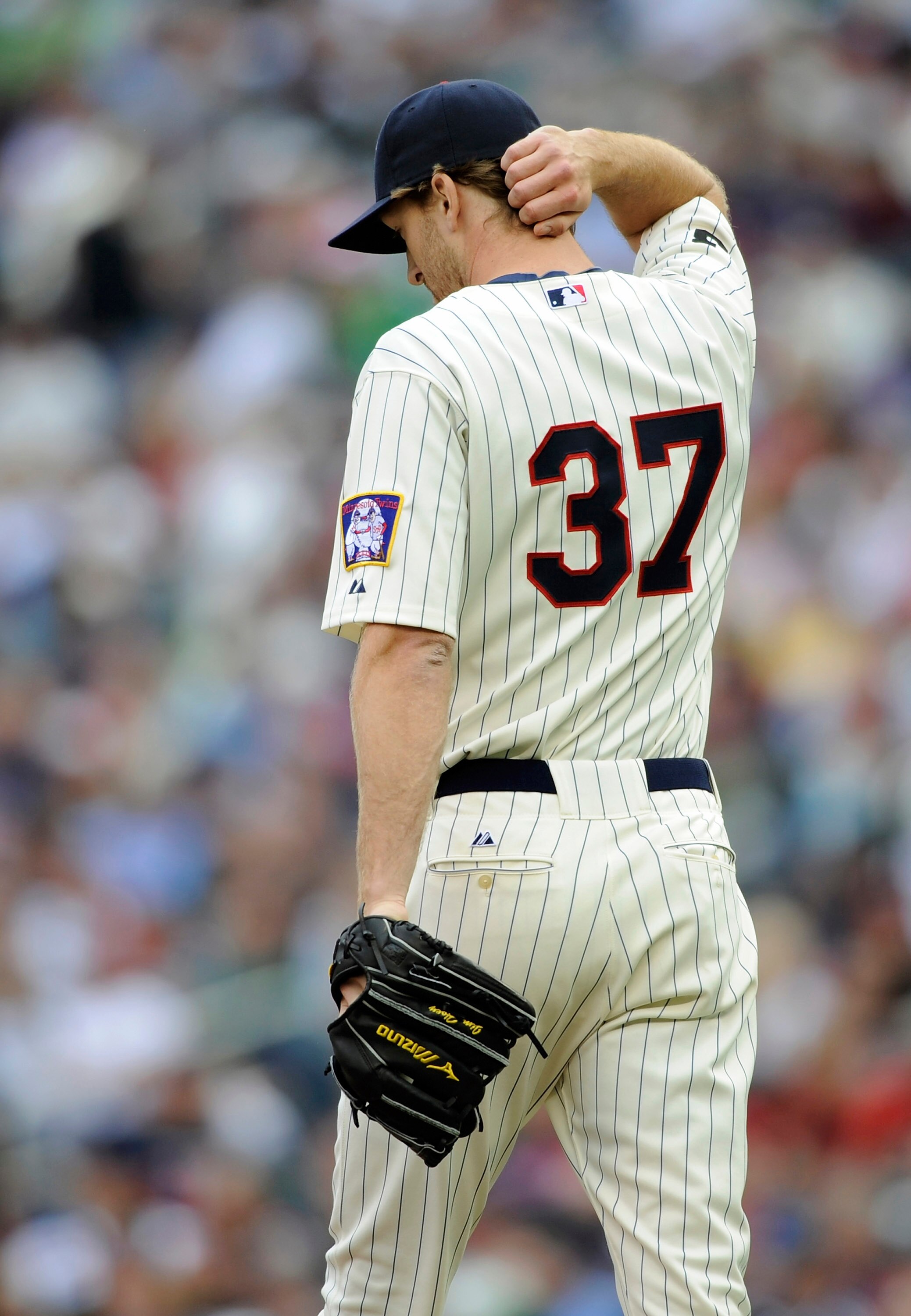 MINNEAPOLIS, MN - MAY 29: Jim Hoey #37 of the Minnesota Twins reacts to giving up a solo home run to Mark Trumbo #44 of the Los Angeles Angels of Anaheim during the ninth inning of their game on May 29, 2011 at Target Field in Minneapolis, Minnesota. Ange MINNEAPOLIS, MN - MAY 29: Jim Hoey #37 of the Minnesota Twins reacts to giving up a solo home run to Mark Trumbo #44 of the Los Angeles Angels of Anaheim during the ninth inning of their game on May 29, 2011 at Target Field in Minneapolis, Minnesota. Ange