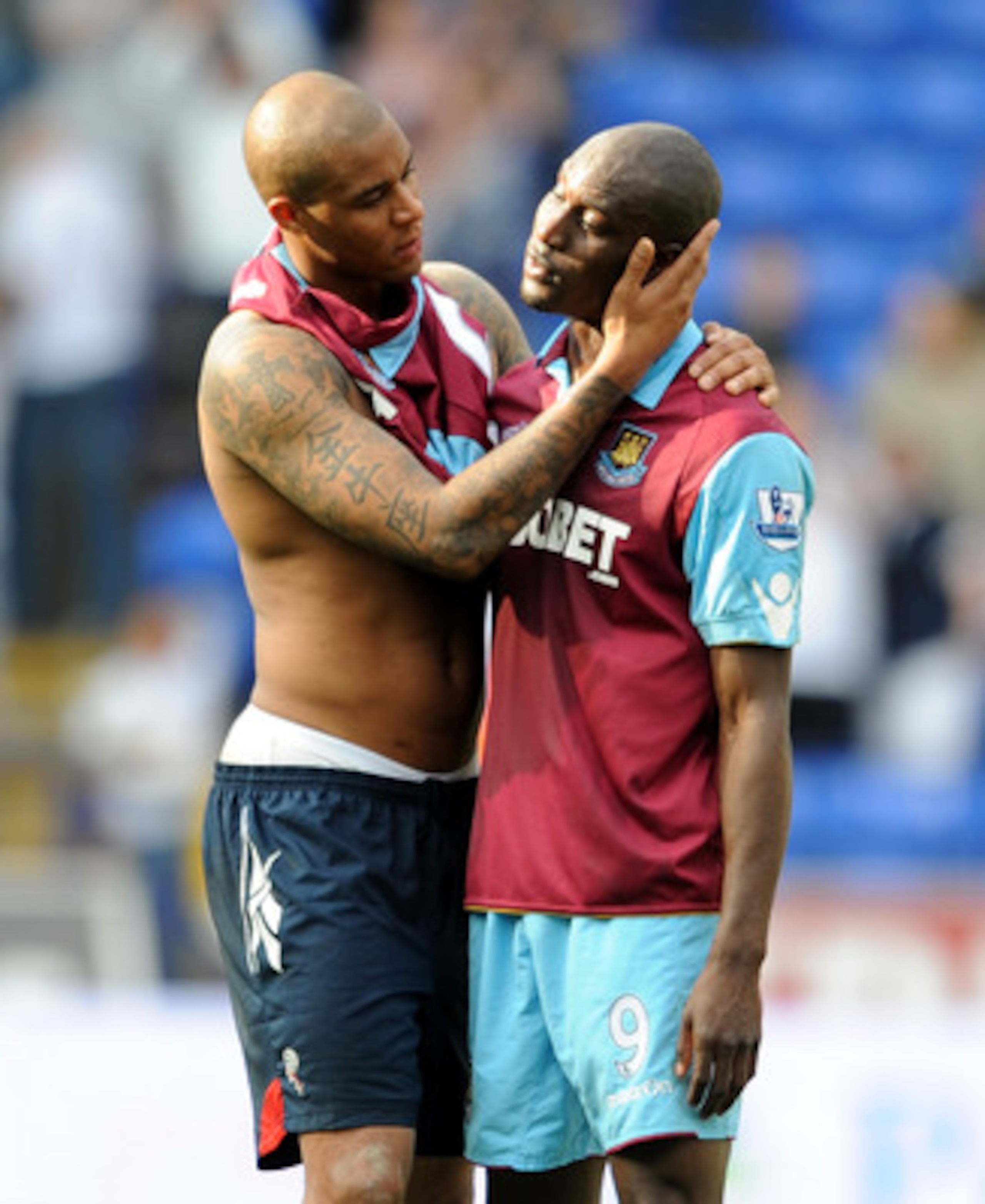 BOLTON, ENGLAND - APRIL 09:  Zat Knight of Bolton Wanderers consoles Carlton Cole of West Ham United at full-time following the Barclays Premier League match between Bolton Wanderers and West Ham United at Reebok Stadium on April 9, 2011 in Bolton, Englan