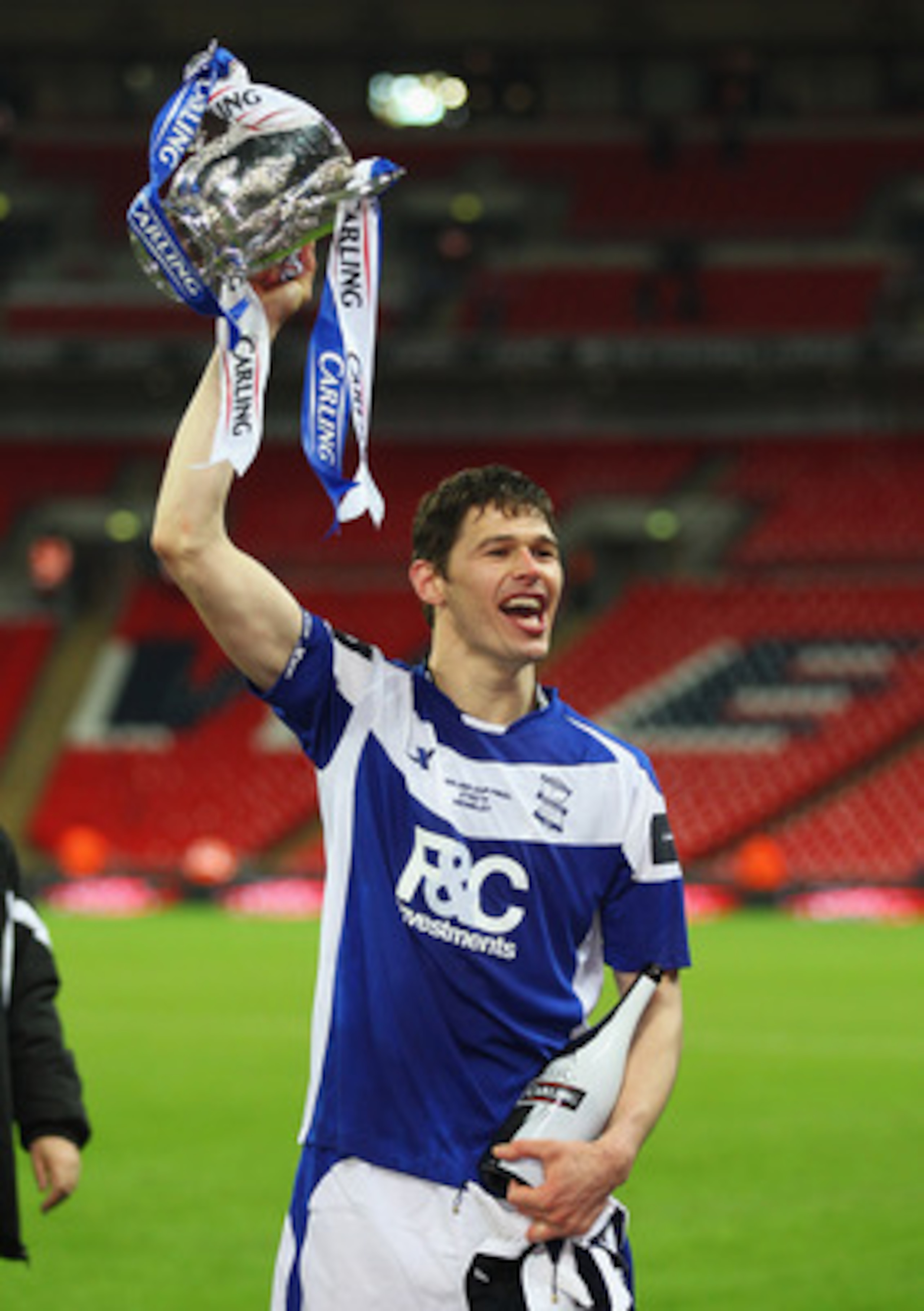 LONDON, ENGLAND - FEBRUARY 27:  Nikola Zigic of Birmingham City celebrates with the trophy after the Carling Cup Final between Arsenal and Birmingham City at Wembley Stadium on February 27, 2011 in London, England.  (Photo by Alex Livesey/Getty Images)