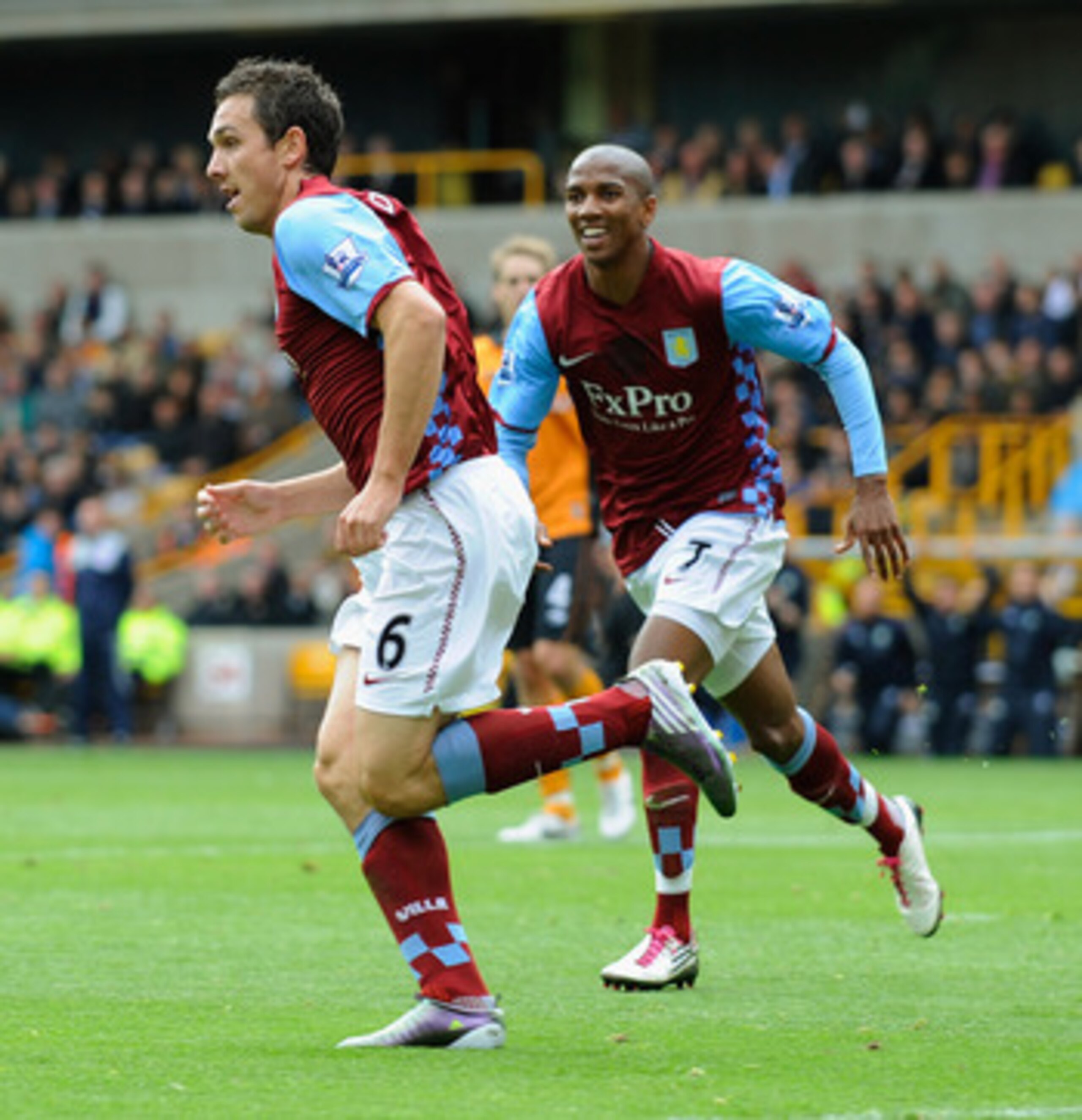 WOLVERHAMPTON, ENGLAND - SEPTEMBER 26:  Stuart Downing of Aston Villa celebrates scoring to make it 1-0 with Ashley Young during the Barclays Premier League match between Wolverhampton Wanderers and Aston Villa at Molineux on September 26, 2010 in Wolverh