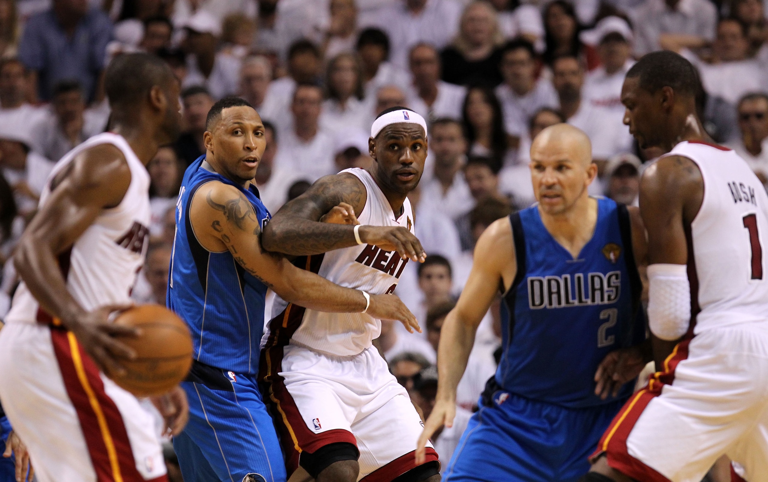 MIAMI, FL - MAY 31:  Dwyane Wade #3 of the Miami Heat looks to pass the ball to LeBron James as CHris Bosh #1 (R) sets a screen against Jason Kidd #2 of the Dallas Mavericks as Shawn Marion (2nd L) #0 of the Mavericks defends James in Game One of the 2011