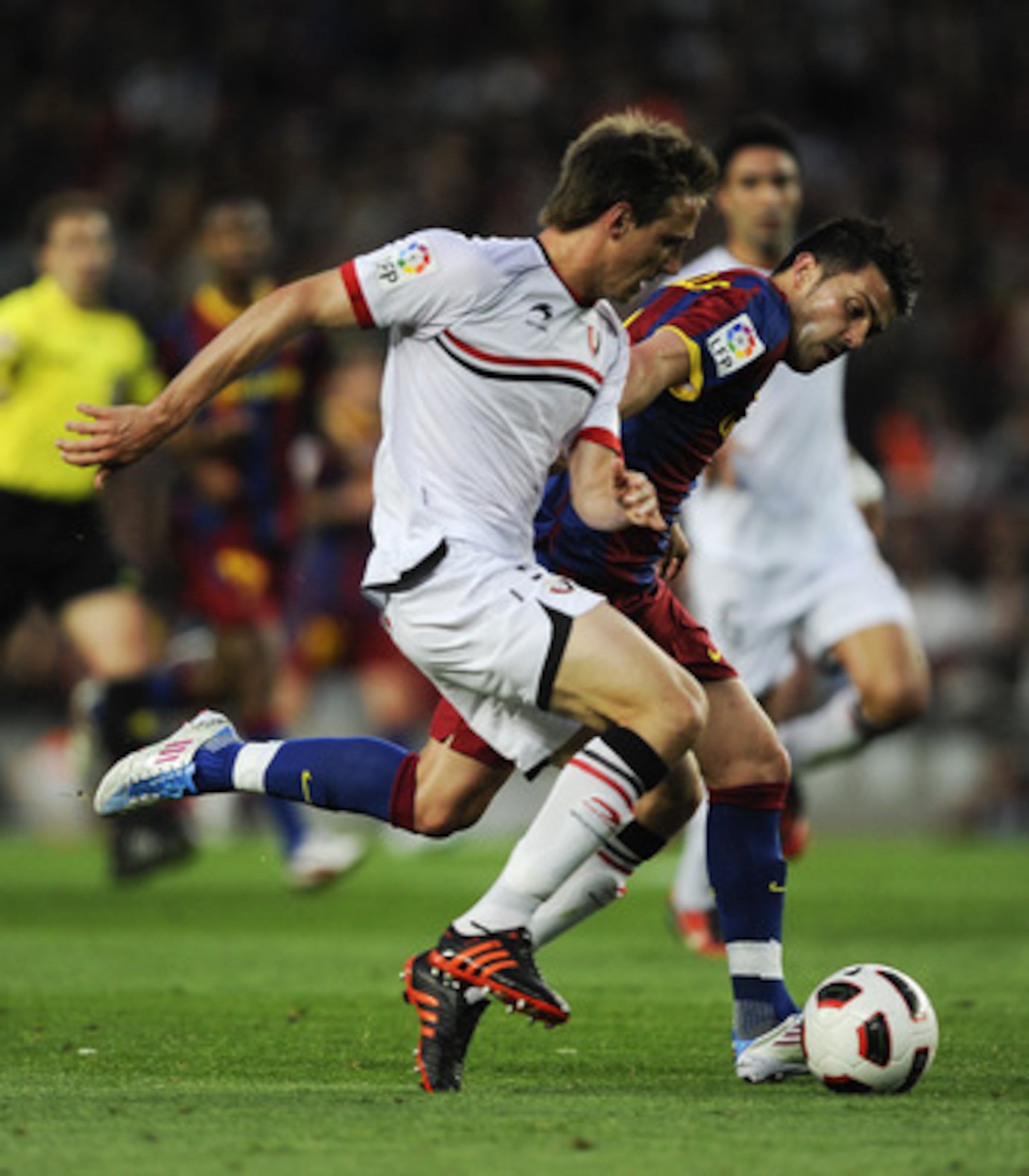 BARCELONA, SPAIN - APRIL 23: David Villa of FC Barcelona fights for the ball against Nacho Monreal of CA Osasuna during the La Liga match between Barcelona and CA Osasuna at Camp Nou Stadium on April 23, 2011 in Barcelona, Spain. (Photo by David Ramos/G BARCELONA, SPAIN - APRIL 23: David Villa of FC Barcelona fights for the ball against Nacho Monreal of CA Osasuna during the La Liga match between Barcelona and CA Osasuna at Camp Nou Stadium on April 23, 2011 in Barcelona, Spain. (Photo by David Ramos/G