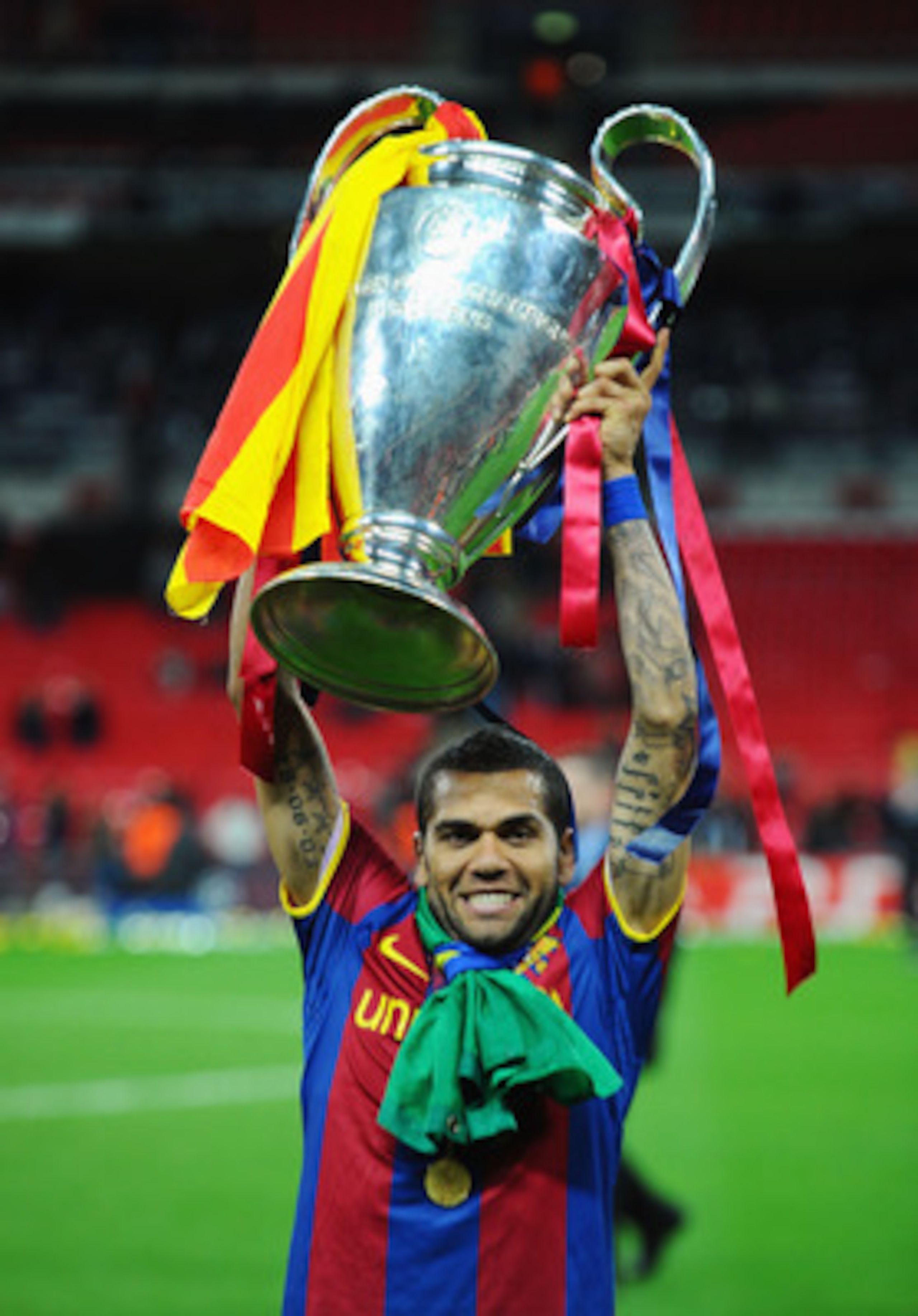 LONDON, ENGLAND - MAY 28: Daniel Alves of FC Barcelona poses with the trophy after victory in the UEFA Champions League final between FC Barcelona and Manchester United FC at Wembley Stadium on May 28, 2011 in London, England. (Photo by Clive Mason/Gett LONDON, ENGLAND - MAY 28: Daniel Alves of FC Barcelona poses with the trophy after victory in the UEFA Champions League final between FC Barcelona and Manchester United FC at Wembley Stadium on May 28, 2011 in London, England. (Photo by Clive Mason/Gett