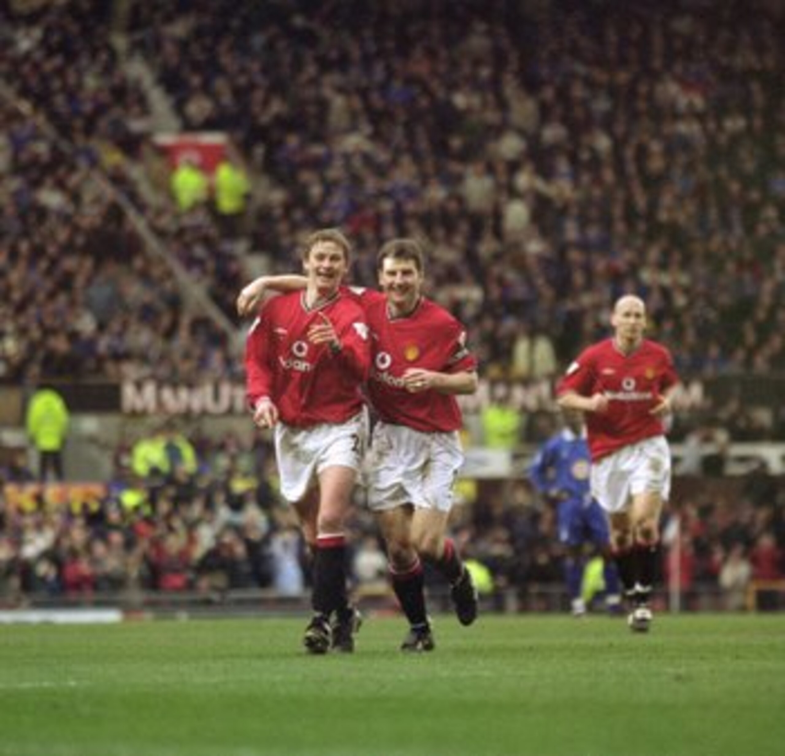 17 Mar 2001:  Ole Gunnar Solskjaer (left) and Denis Irwin (right) of Manchester United celebrate during the FA Carling Premiership match against Leicester City played at Old Trafford, in Manchester, England. Manchester United won the match 2-0. \ Mandator