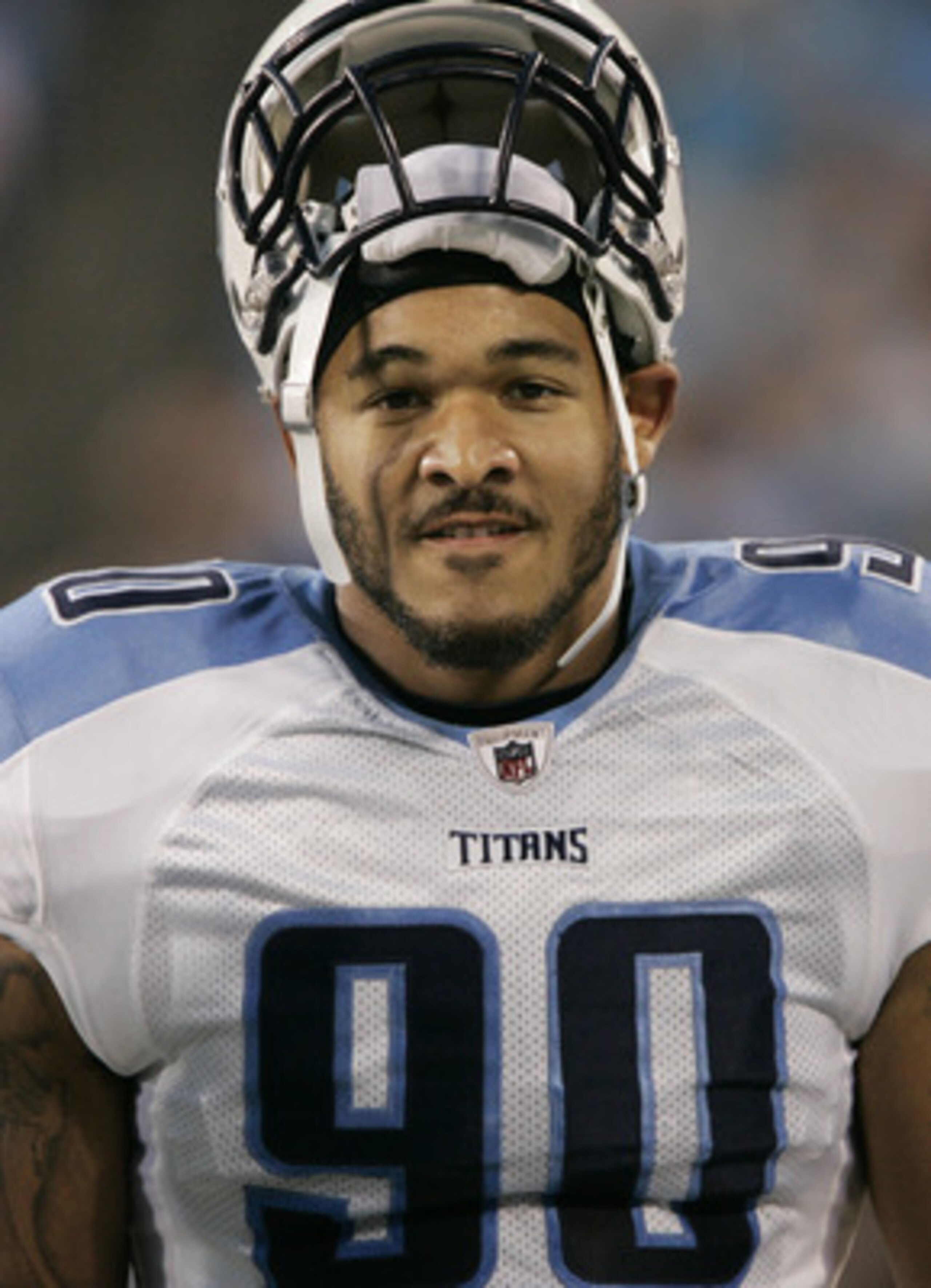 CHARLOTTE, NC - AUGUST 28: Defensive end Derrick Morgan #90 of the Tennessee Titans rests his helmet on top of his head as he walks along the sidelines before the start of their preseason game against the Carolina Panther at Bank of America Stadium on Au CHARLOTTE, NC - AUGUST 28: Defensive end Derrick Morgan #90 of the Tennessee Titans rests his helmet on top of his head as he walks along the sidelines before the start of their preseason game against the Carolina Panther at Bank of America Stadium on Au