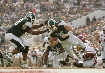 ORLANDO, FL - JANUARY 01:  Kirk Cousins #8  of the Michigan State Spartans is sacked by Courtney Upshaw #41 of the Alabama Crimson Tide during the Capitol One Bowl at the Florida Citrus Bowl on January 1, 2011 in Orlando, Florida.  (Photo by Mike Ehrmann/