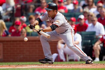 ST. LOUIS, MO - MAY 30: Andres Torres #56 of the San Francisco Giants lays down a sacrifice bunt against the St. Louis Cardinals at Busch Stadium on May 30, 2011 in St. Louis, Missouri.  (Photo by Dilip Vishwanat/Getty Images)
