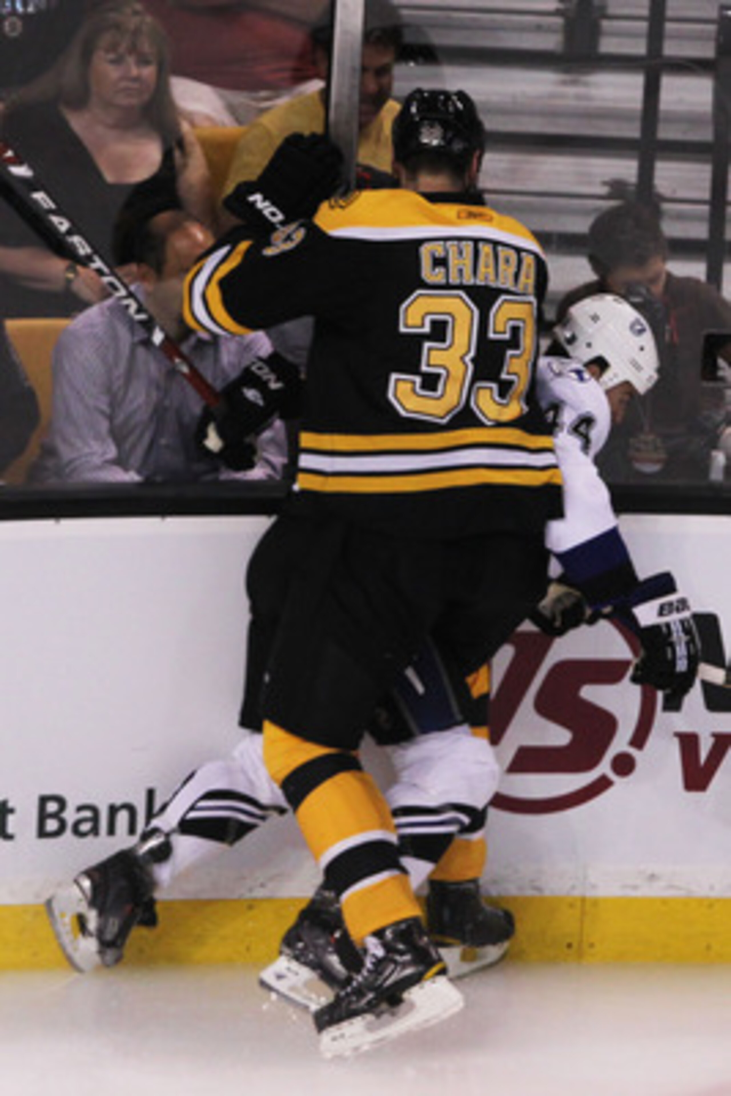 BOSTON, MA - MAY 27:  Zdeno Chara #33 of the Boston Bruins checks Nate Thompson #44 of the Tampa Bay Lightning in the first period of Game Seven of the Eastern Conference Finals during the 2011 NHL Stanley Cup Playoffs at TD Garden on May 27, 2011 in Bost