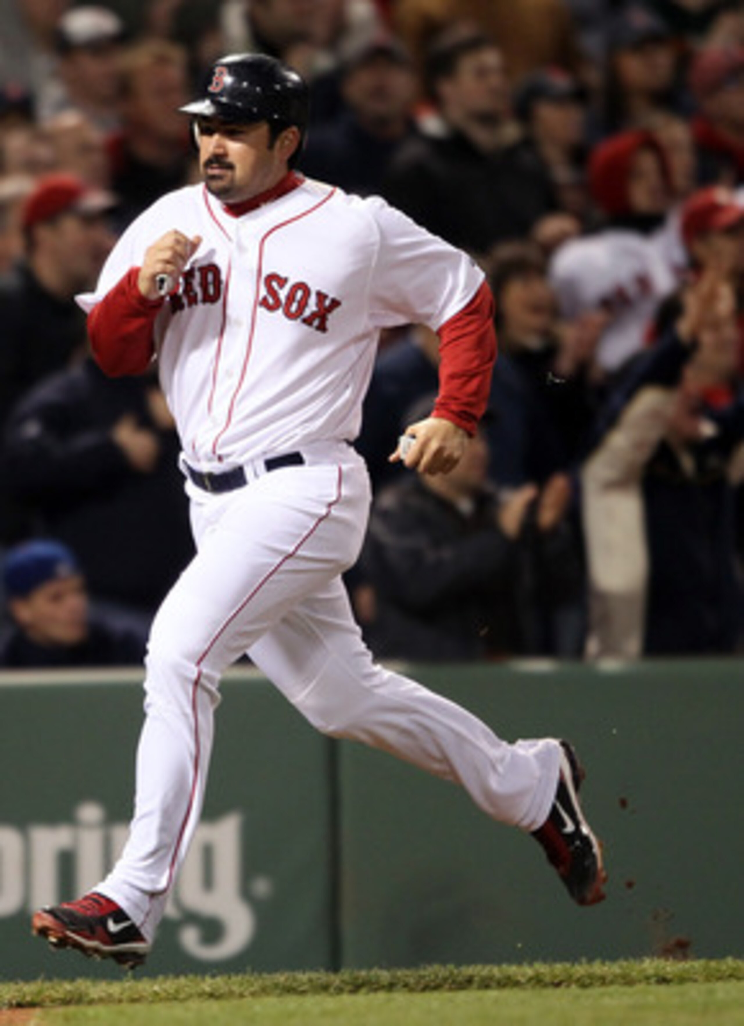 BOSTON, MA - MAY 22:  Adrian Gonzalez #28 of the Boston Red Sox scores in the seventh inning against the Chicago Cubs on May 22, 2011 at Fenway Park in Boston, Massachusetts.  Before this series, the two teams haven't played at Fenway Park since the 1918 