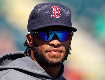 BRADENTON, FL - MARCH 13:  Outfielder Darnell McDonald #54 of the Boston Red Sox warms up prior to the start of the Grapefruit League Spring Training Game against the Pittsburgh Pirates at McKechnie Field on March 13, 2011 in Bradenton, Florida.  (Photo b