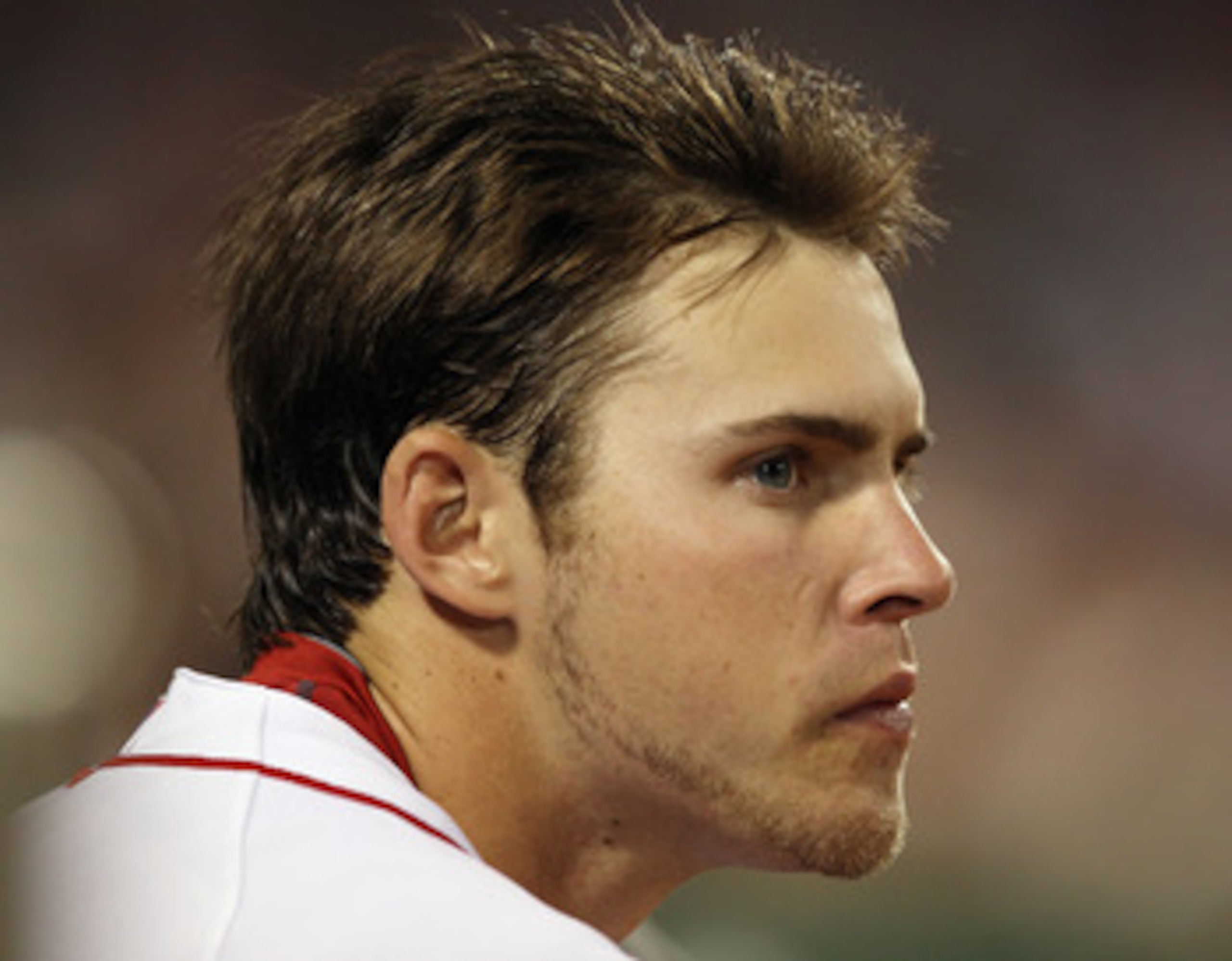BOSTON - SEPTEMBER 22:  Josh Reddick #46 of the Boston Red Sox looks on from the dugout in the game against the Baltimore Orioles on September 22, 2010 at Fenway Park in Boston, Massachusetts.  (Photo by Elsa/Getty Images)