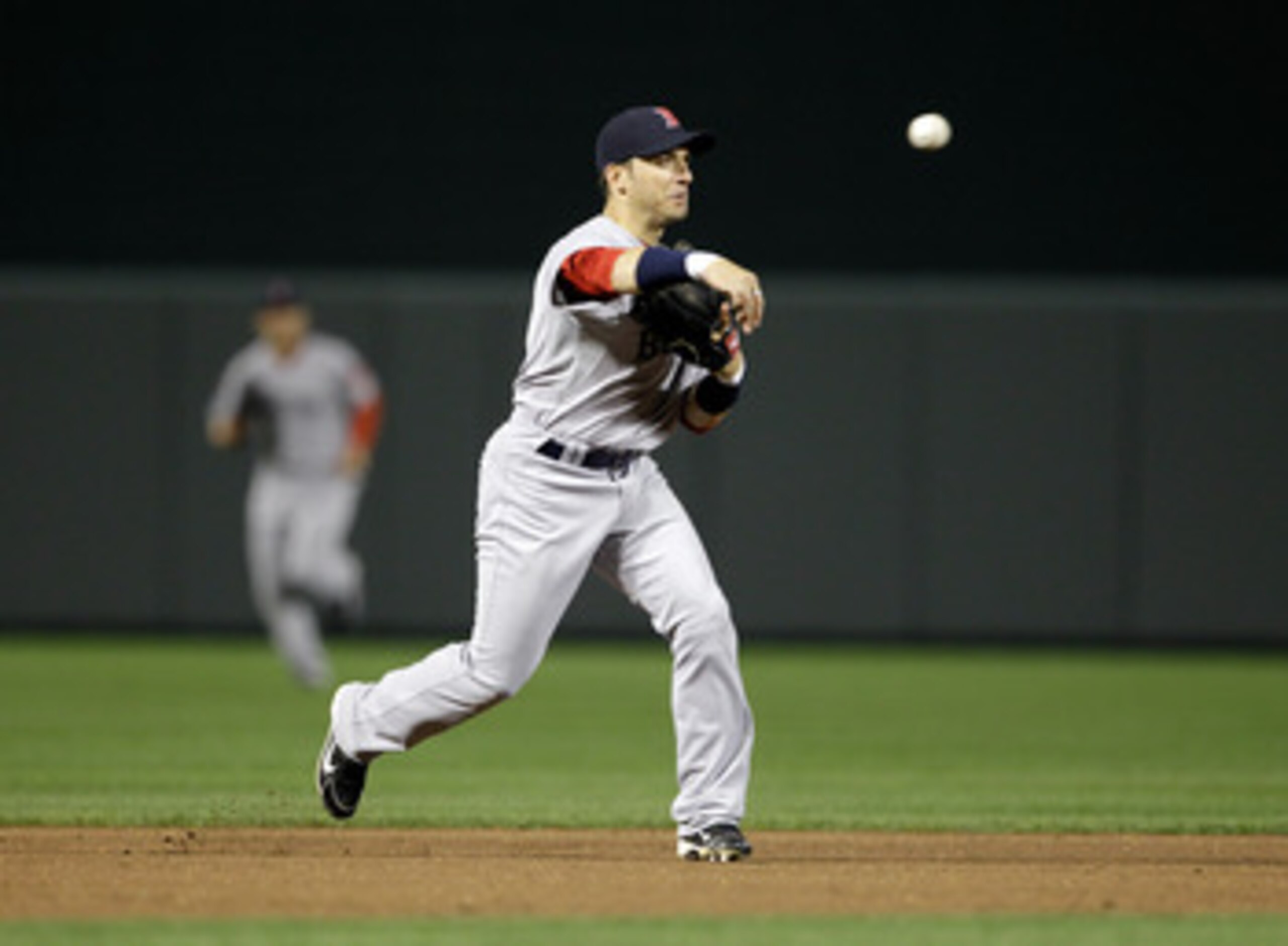 BALTIMORE, MD - APRIL 28: Shortstop Marco Scutaro #10 of the Boston Red Sox throws to first base against the Baltimore Orioles at Oriole Park at Camden Yards on April 28, 2011 in Baltimore, Maryland.  (Photo by Rob Carr/Getty Images)