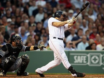 BOSTON, MA - MAY 31:  Jason Varitek #33 of the Boston Red Sox hits a solo home run in the third inning as A.J. Pierzynski #12 of the Chicago White Sox catches on May 31, 2011 at Fenway Park in Boston, Massachusetts.  (Photo by Elsa/Getty Images)
