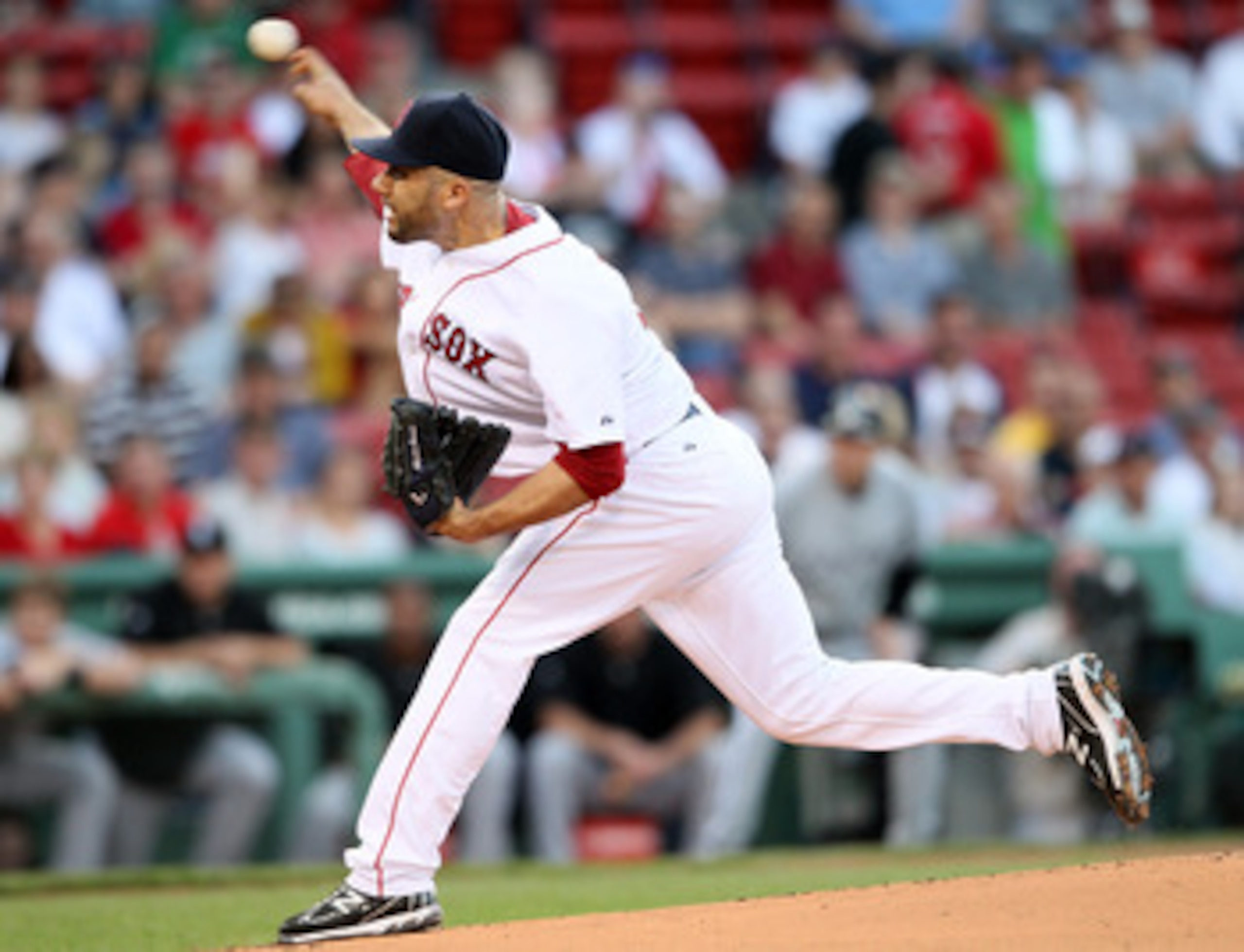 BOSTON, MA - MAY 31:  Alfredo Aceves #91 of the Boston Red Sox delivers a pitch in the first inning against the Chicago White Sox on May 31, 2011 at Fenway Park in Boston, Massachusetts.  (Photo by Elsa/Getty Images)