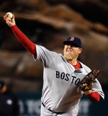 ANAHEIM, CA - APRIL 21:  Pitcher Bobby Jenks #52 of the Boston Red Sox throws a pitch against the Los Angeles Angels of Anaheim during the 10th inning of the baseball game at Angel Stadium of Anaheim on April 21, 2011 in Anaheim, California. Red Sox defea