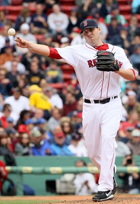 BOSTON, MA - MAY 05:  John Lackey #41 of the Boston Red Sox tries to pick of Torii Hunter of the Los Angeles Angels on May 5, 2011 at Fenway Park in Boston, Massachusetts.  (Photo by Elsa/Getty Images)