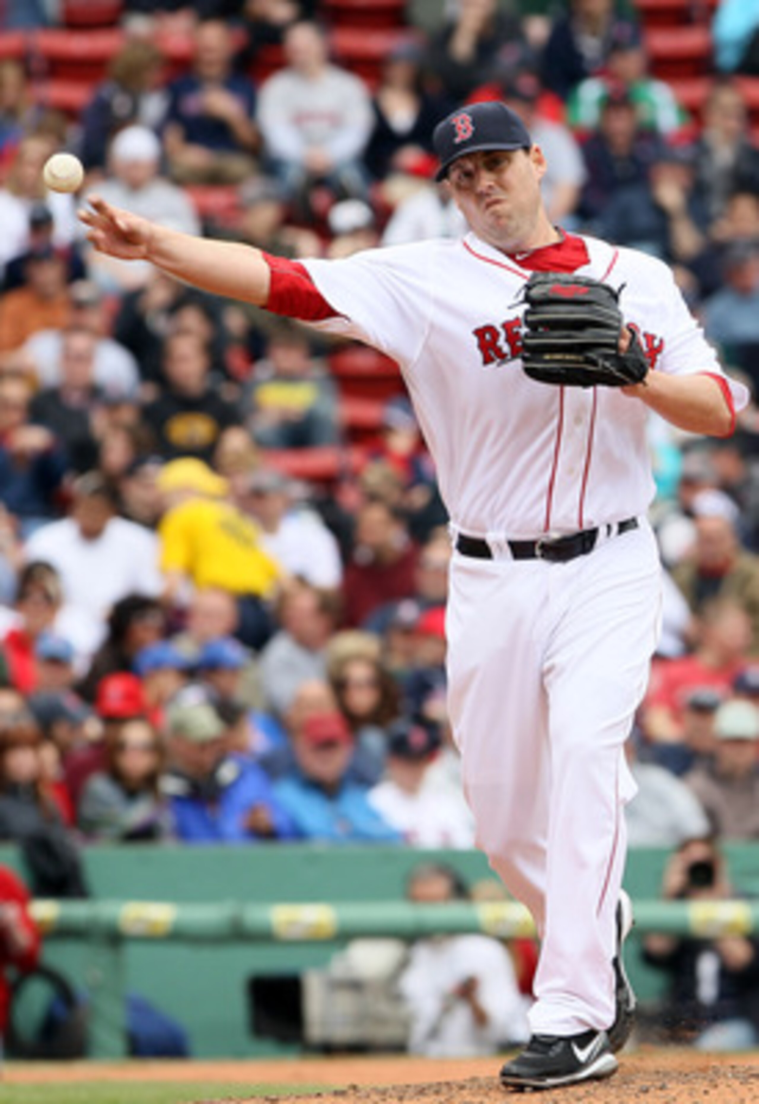 BOSTON, MA - MAY 05:  John Lackey #41 of the Boston Red Sox tries to pick of Torii Hunter of the Los Angeles Angels on May 5, 2011 at Fenway Park in Boston, Massachusetts.  (Photo by Elsa/Getty Images)
