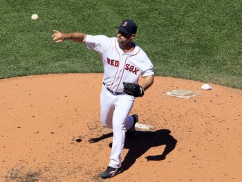 BOSTON, MA - MAY 01:  Tim Wakefield #49 of the Boston Red Sox delivers a pitch against the Seattle Mariners on May 1, 2011 at Fenway Park in Boston, Massachusetts.  (Photo by Elsa/Getty Images)