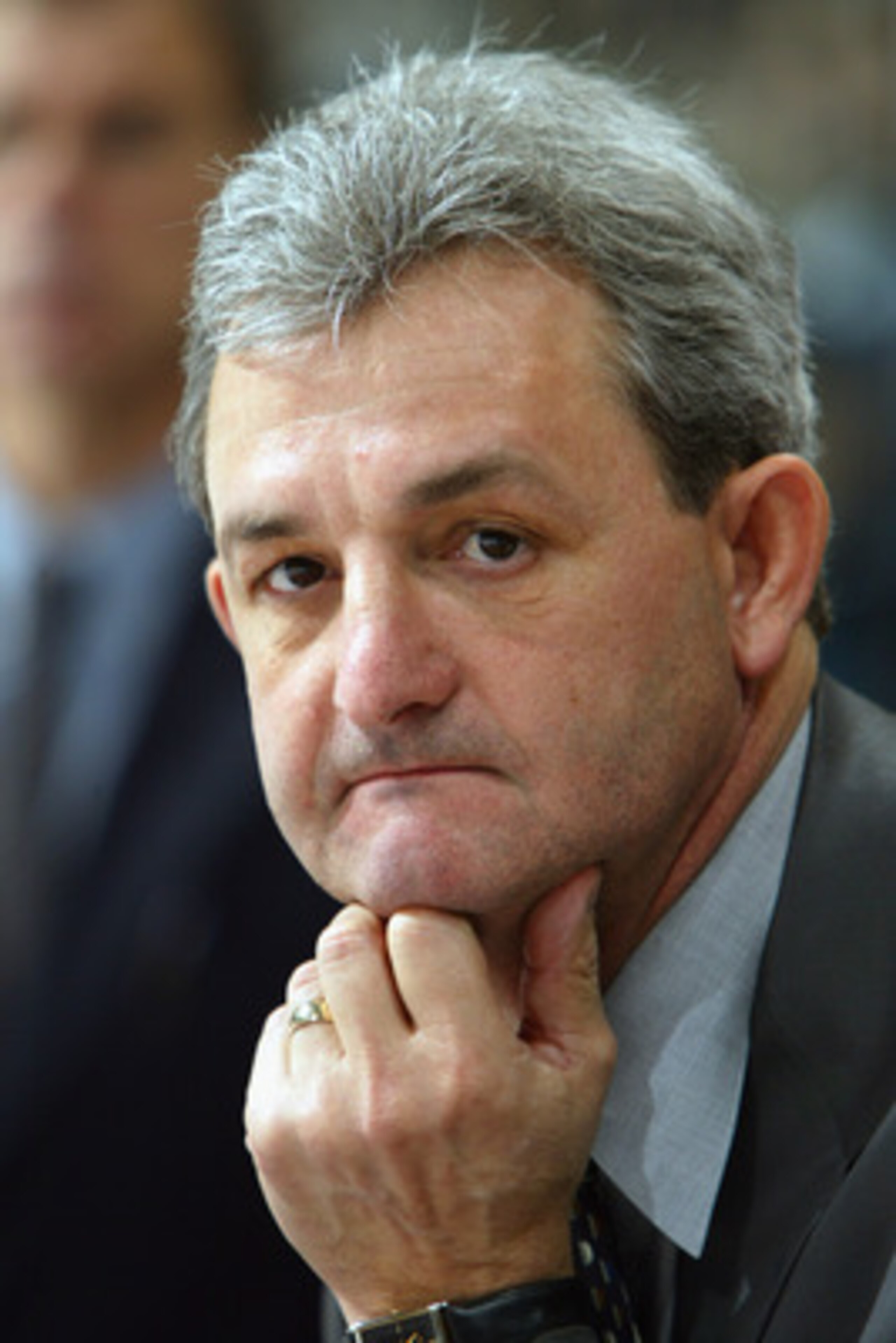 VANCOUVER - DECEMBER 4:  Head coach Darryl Sutter of the Calgary Flames watches the game against the Vancouver Canucks at General Motors Place on December 4, 2003 in Vancouver, Canada.  Calgary defeated Vancouver 4-1. (Photo by Jeff Vinnick/Getty Images)