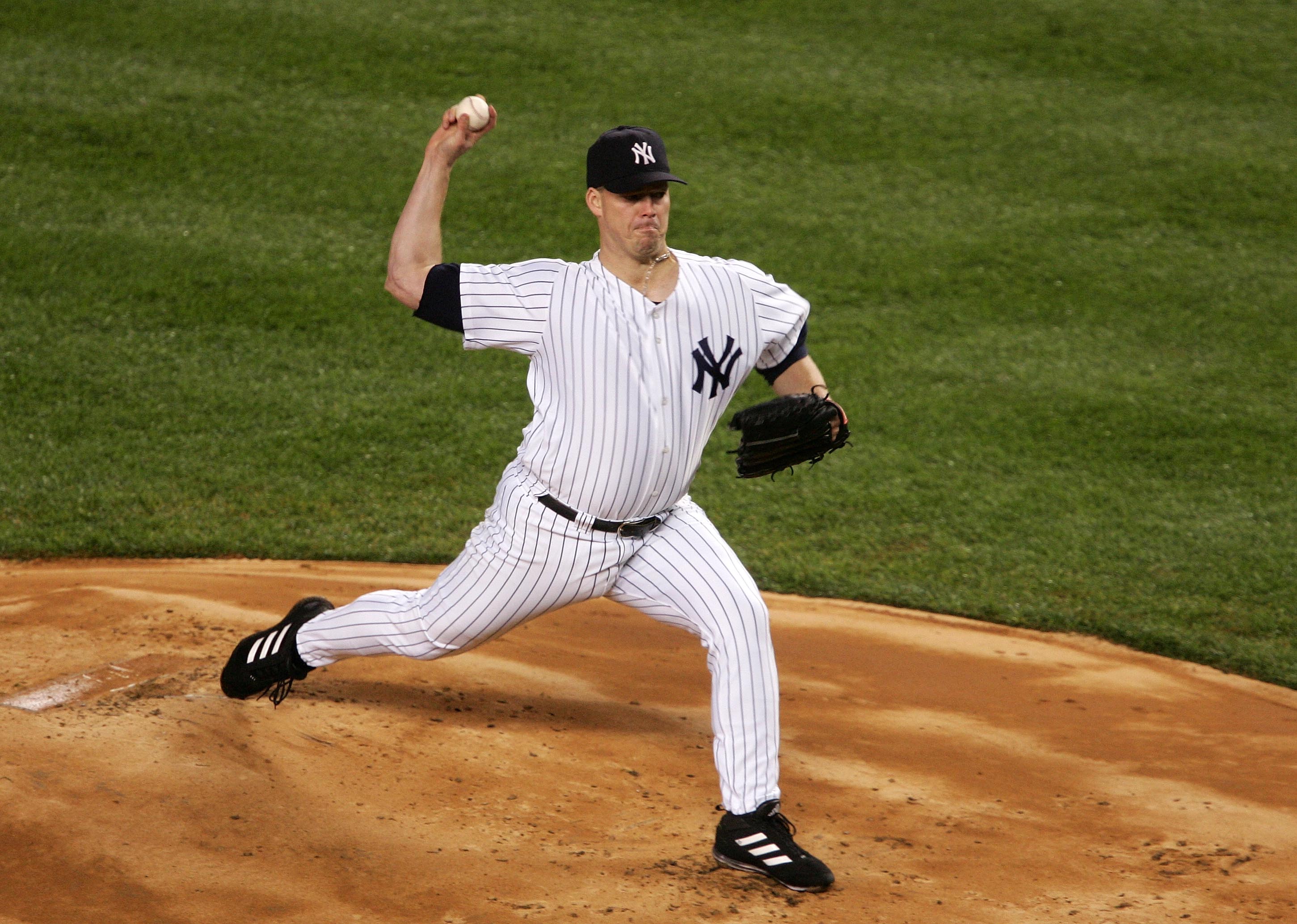 NEW YORK - OCTOBER 19:  Jon Lieber #22 of the New York Yankees throws a pitch in the first inning against the Boston Red Sox during game six of the American League Championship Series on October 19, 2004 at Yankee Stadium in the Bronx borough of New York