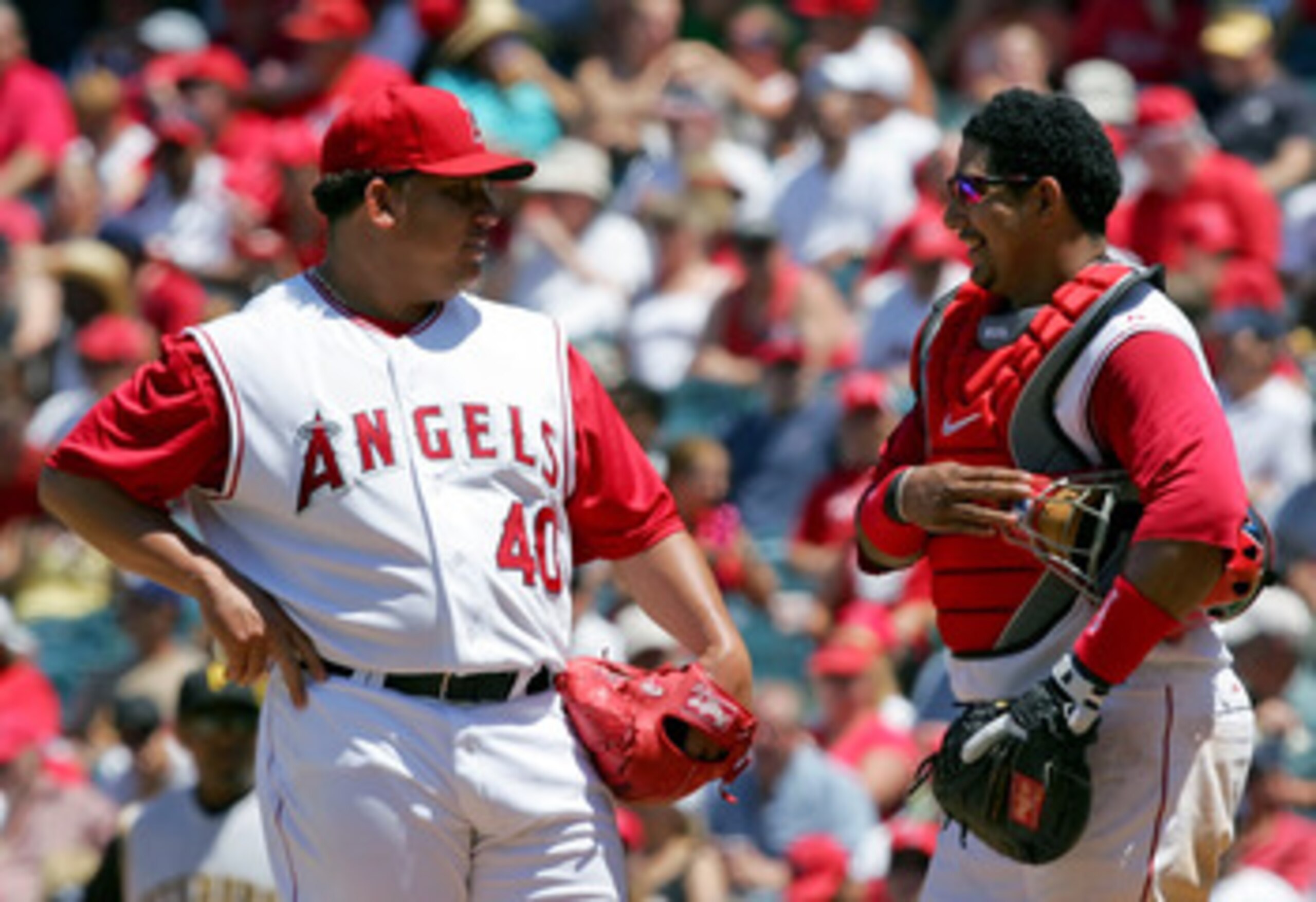 ANAHEIM, CA - JUNE 24: (L-R) Bartolo Colon #40 and Jose Molina #28 of the Los Angeles Angels of Anaheim meet on the mound during the game against the Pittsburgh Pirates at Angels Stadium on June 24, 2007 in Anaheim, California. (Photo by Lisa Blumenfel ANAHEIM, CA - JUNE 24: (L-R) Bartolo Colon #40 and Jose Molina #28 of the Los Angeles Angels of Anaheim meet on the mound during the game against the Pittsburgh Pirates at Angels Stadium on June 24, 2007 in Anaheim, California. (Photo by Lisa Blumenfel