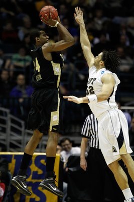 MILWAUKEE - MARCH 19:  Keith Benson #34 of the Oakland Golden Grizzlies shoots the ball over Gary McGhee #52 of the Pittsburgh Panthers in the second half during the first round of the 2010 NCAA men's basketball tournament at the Bradley Center on March 1