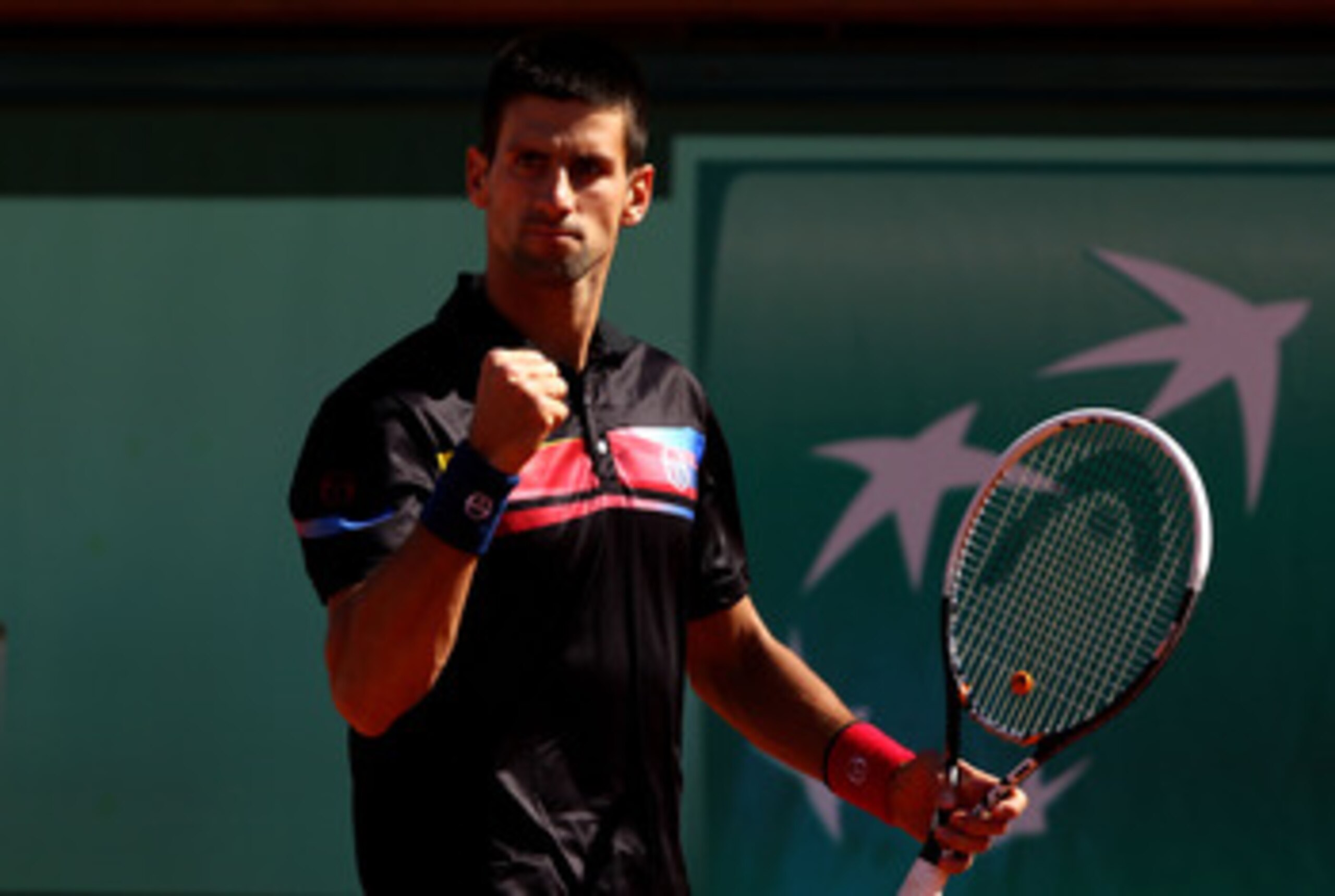 PARIS, FRANCE - MAY 25:  Novak Djokovic of Serbia celebrates a point during the men's singles round two match between Victor Hanescu of Romania and Novak Djokovic of Serbia on day four of the French Open at Roland Garros on May 25, 2011 in Paris, France. 