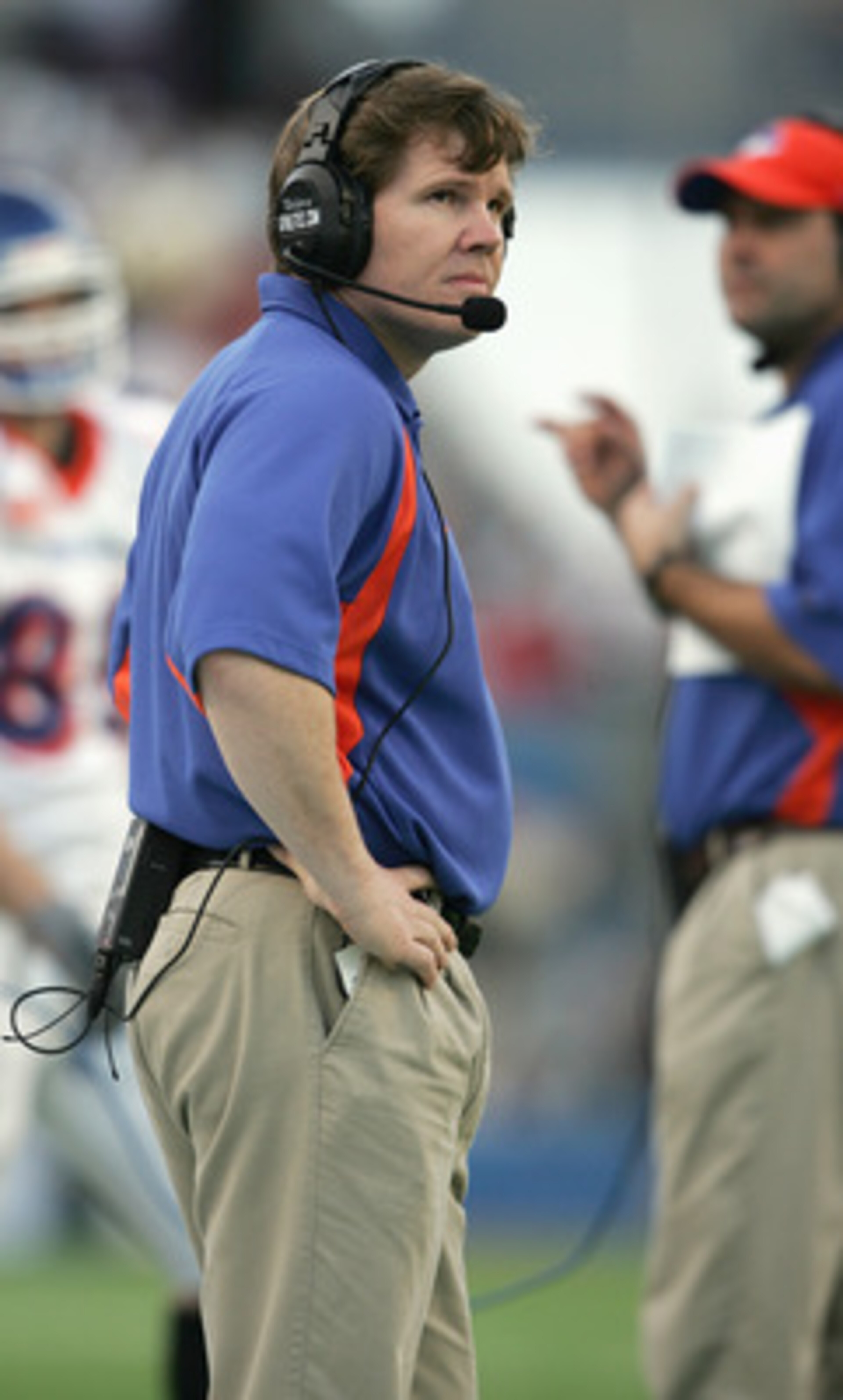 MEMPHIS,TN - DECEMBER 31: Head coach Dan Hawkins of the Boise State Broncos looks on while facing the Louisville Cardinals during the AutoZone Liberty bowl at the Liberty Bowl on December 31, 2004 in Memphis, Tennessee. Louisville won 44-40. (Photo by MEMPHIS,TN - DECEMBER 31: Head coach Dan Hawkins of the Boise State Broncos looks on while facing the Louisville Cardinals during the AutoZone Liberty bowl at the Liberty Bowl on December 31, 2004 in Memphis, Tennessee. Louisville won 44-40. (Photo by
