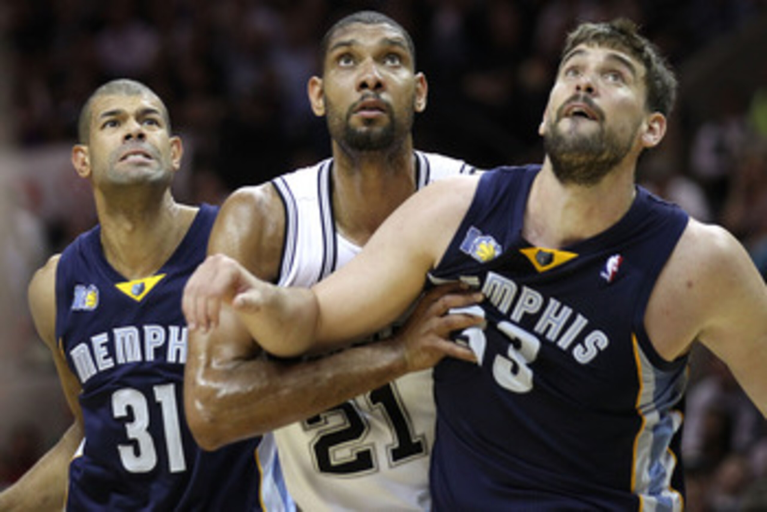 SAN ANTONIO, TX - APRIL 27:  Tim Duncan #21 of the San Antionio Spurs battles for a rebound against Shane Battier #31 and Marc Gasol #33 of the Memphis Grizzlies in Game Five of the Western Conference Quarterfinals in the 2011 NBA Playoffs on April 27, 20