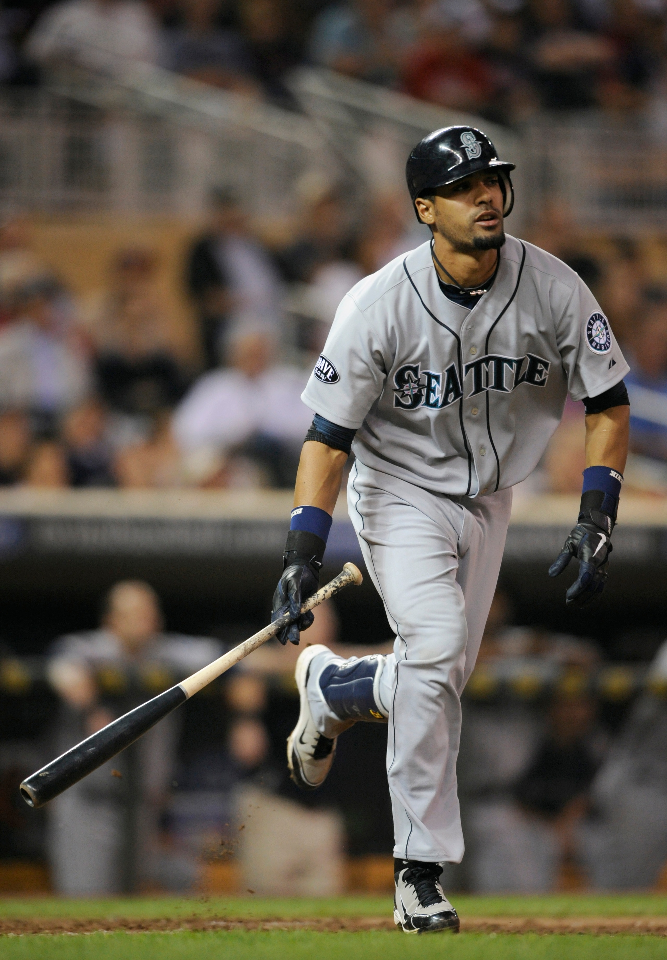 MINNEAPOLIS, MN - MAY 23: Franklin Gutierrez #21 of the Seattle Mariners runs towards first base after hitting the ball into play against the Minnesota Twins during their game on May 23, 2011 at Target Field in Minneapolis, Minnesota. The Rockies won 6-5.