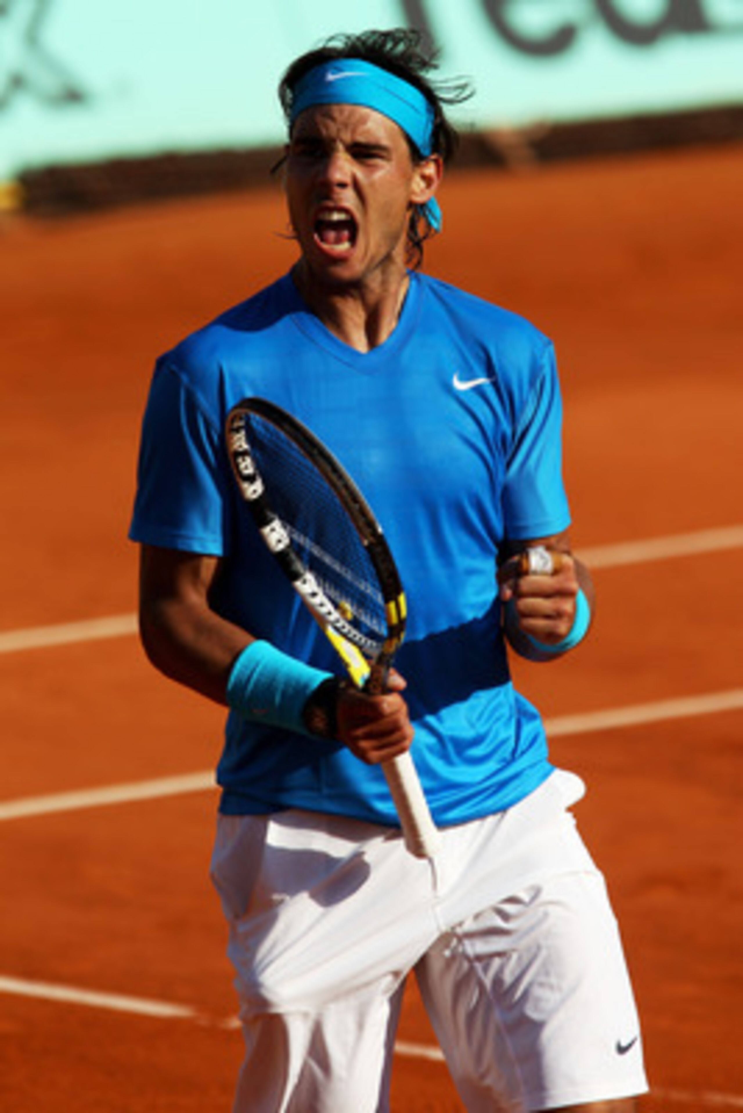 PARIS, FRANCE - JUNE 01:  Rafael Nadal of Spain celebrates a point during the men's singles quarterfinal match between Rafael Nadal of Spain and Robin Soderling of Sweden on day eleven of the French Open at Roland Garros on June 1, 2011 in Paris, France. 