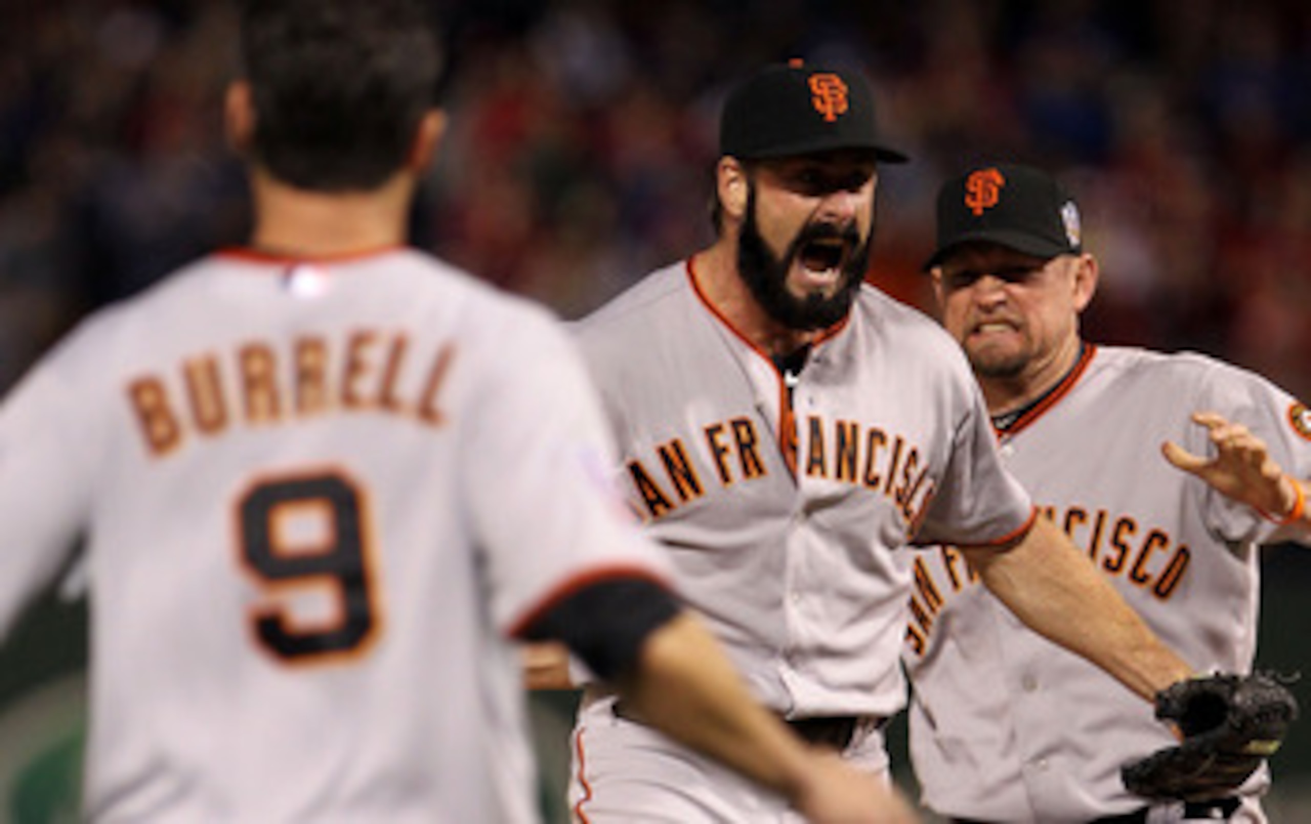 ARLINGTON, TX - NOVEMBER 01:  Brian Wilson (C) #38, Aubrey Huff #17 (R) and Pat Burrell #9 of  the San Francisco Giants celebrate on the field after the Giants won 3-1 against the Texas Rangers in Game Five of the 2010 MLB World Series at Rangers Ballpark