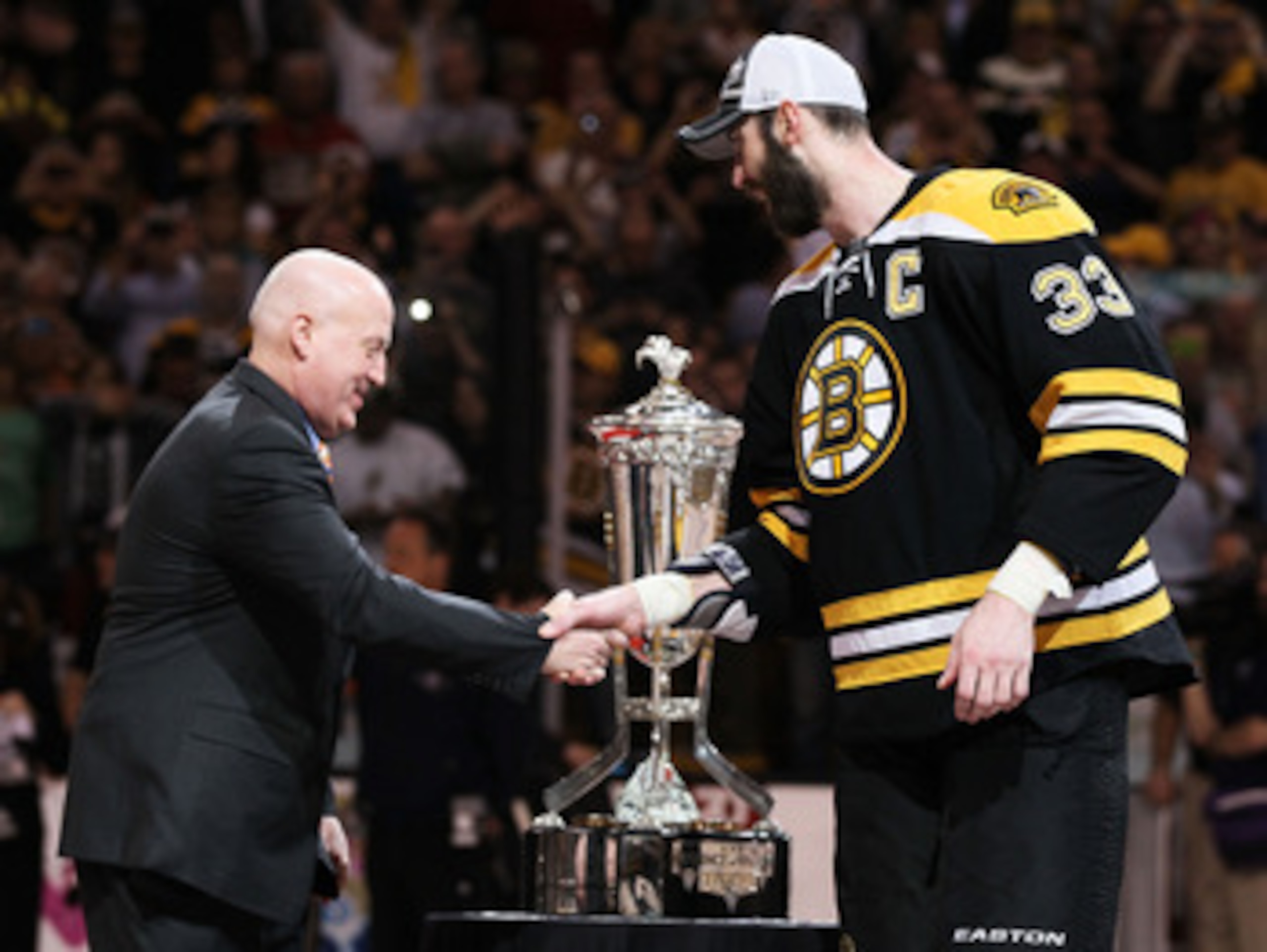 BOSTON, MA - MAY 27:  Deputy Commissioner Bill Daly shakes the hand of Zdeno Chara #33 of the Boston Bruins as he presents the The Prince of Wales trophy after they defeated the Tampa Bay Lightning 1 to 0 in Game Seven of the Eastern Conference Finals dur