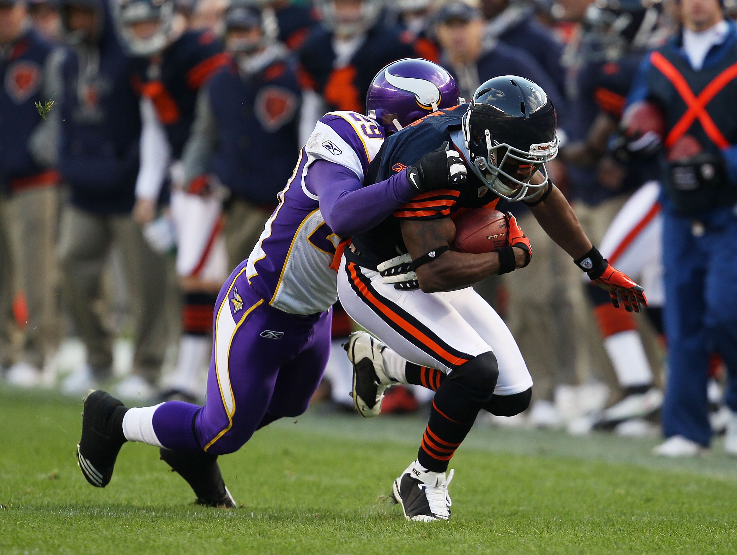 CHICAGO - NOVEMBER 14: Rashied Davis #81 of the Chicago Bears is tackled by Lito Sheppard #29 of the Minnesota Vikings at Soldier Field on November 14, 2010 in Chicago, Illinois. The Bears defeated the Vikings 27-13. (Photo by Jonathan Daniel/Getty Images