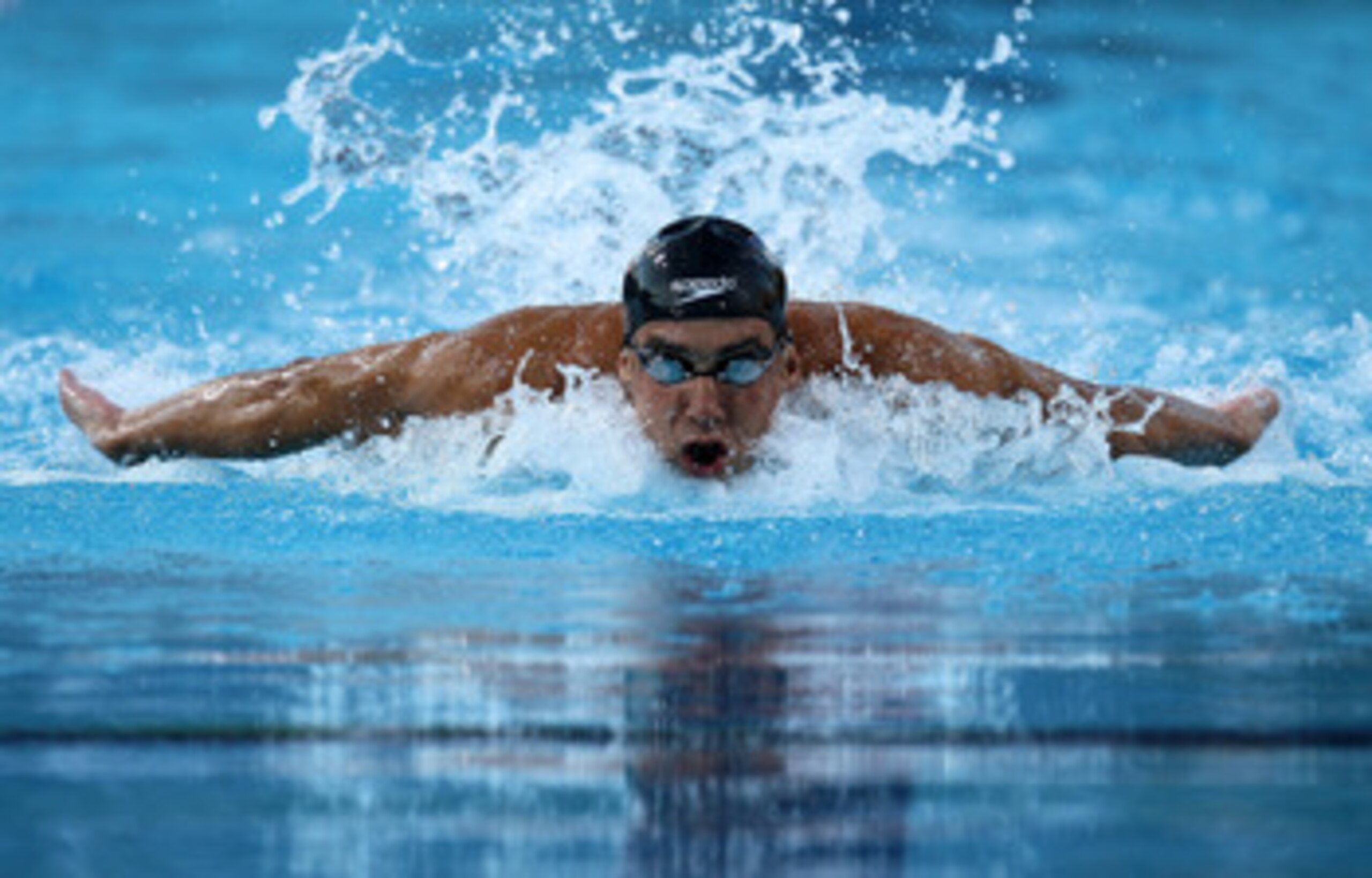 IRVINE, CA - AUGUST 20:  Michael Phelps swims on his way to winning the men's 100m butterfly during the Mutual of Omaha Pan Pacific Championships at the William Woollett Jr. Aquatic Center on August 20, 2010 in Irvine, California.  (Photo by Stephen Dunn/