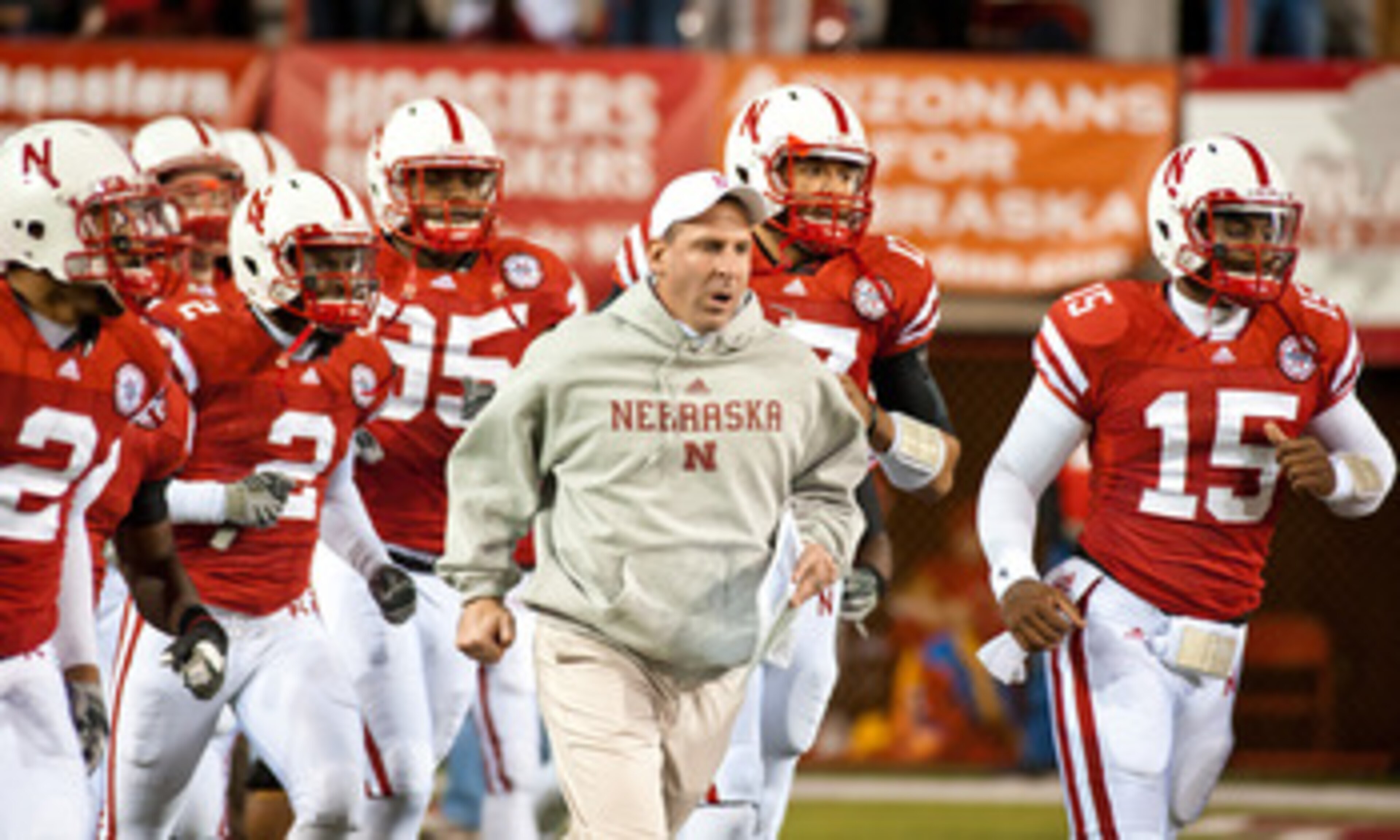 LINCOLN, NE - NOVEMBER 13: Coach Bo Pelini of the Nebraska Cornhuskers leads his team onto the field to play the Kansas Jayhawks at Memorial Stadium on November 13, 2010 in Lincoln, Nebraska. Nebraska Defeated Kansas 20-3. (Photo by Eric Francis/Getty Ima