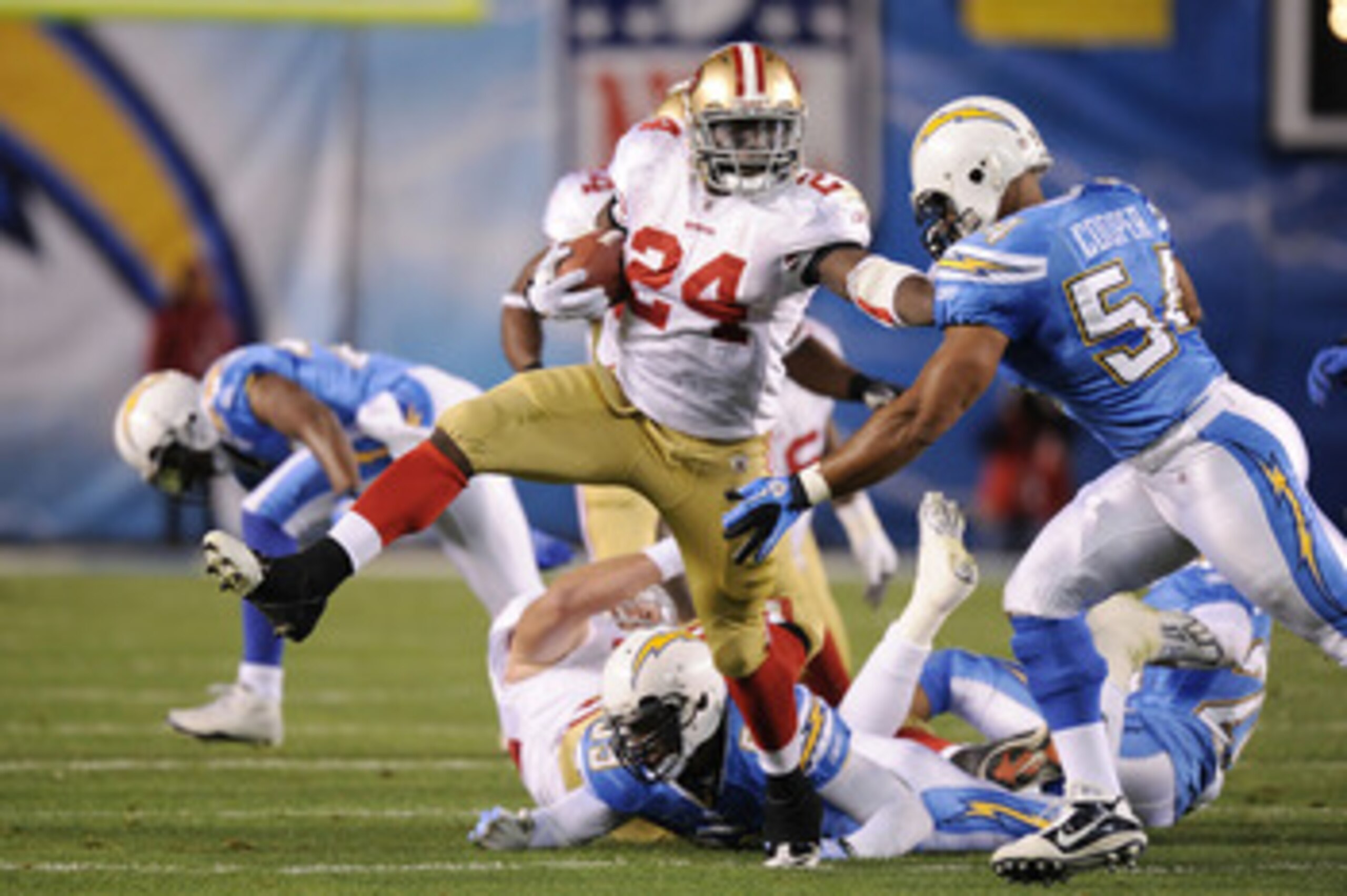 SAN DIEGO, CA - DECEMBER 16:  Running back Anthony Dixon #24 of the San Francisco 49ers rushes with the ball against the San Diego Chargers at Qualcomm Stadium on December 16, 2010 in San Diego, California.  (Photo by Harry How/Getty Images)