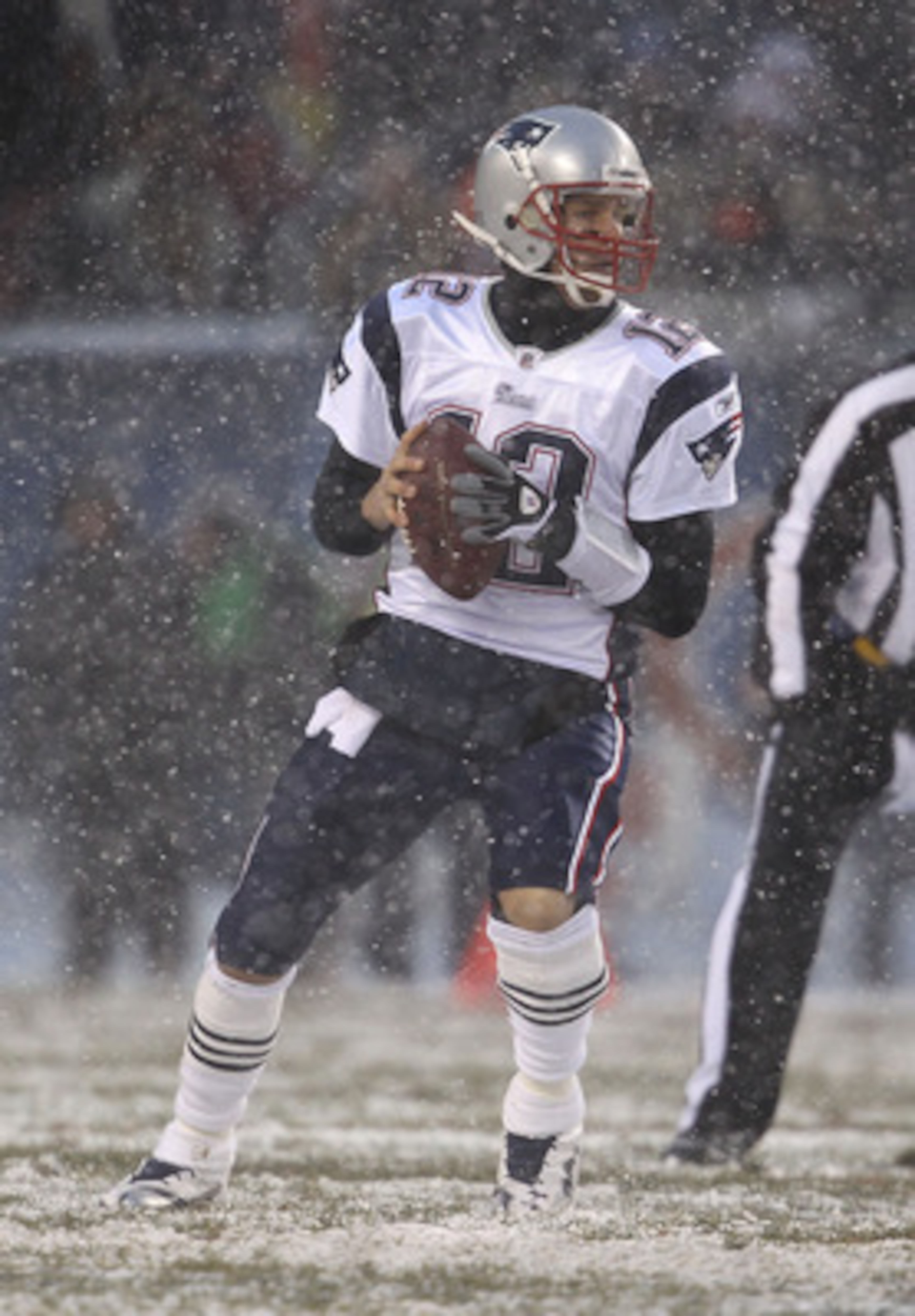 CHICAGO, IL - DECEMBER 12: Tom Brady #12 of the New England Patriots looks for a receiver against the Chicago Bears at Soldier Field on December 12, 2010 in Chicago, Illinois. The Patriots defeated the Bears 36-7. (Photo by Jonathan Daniel/Getty Images)